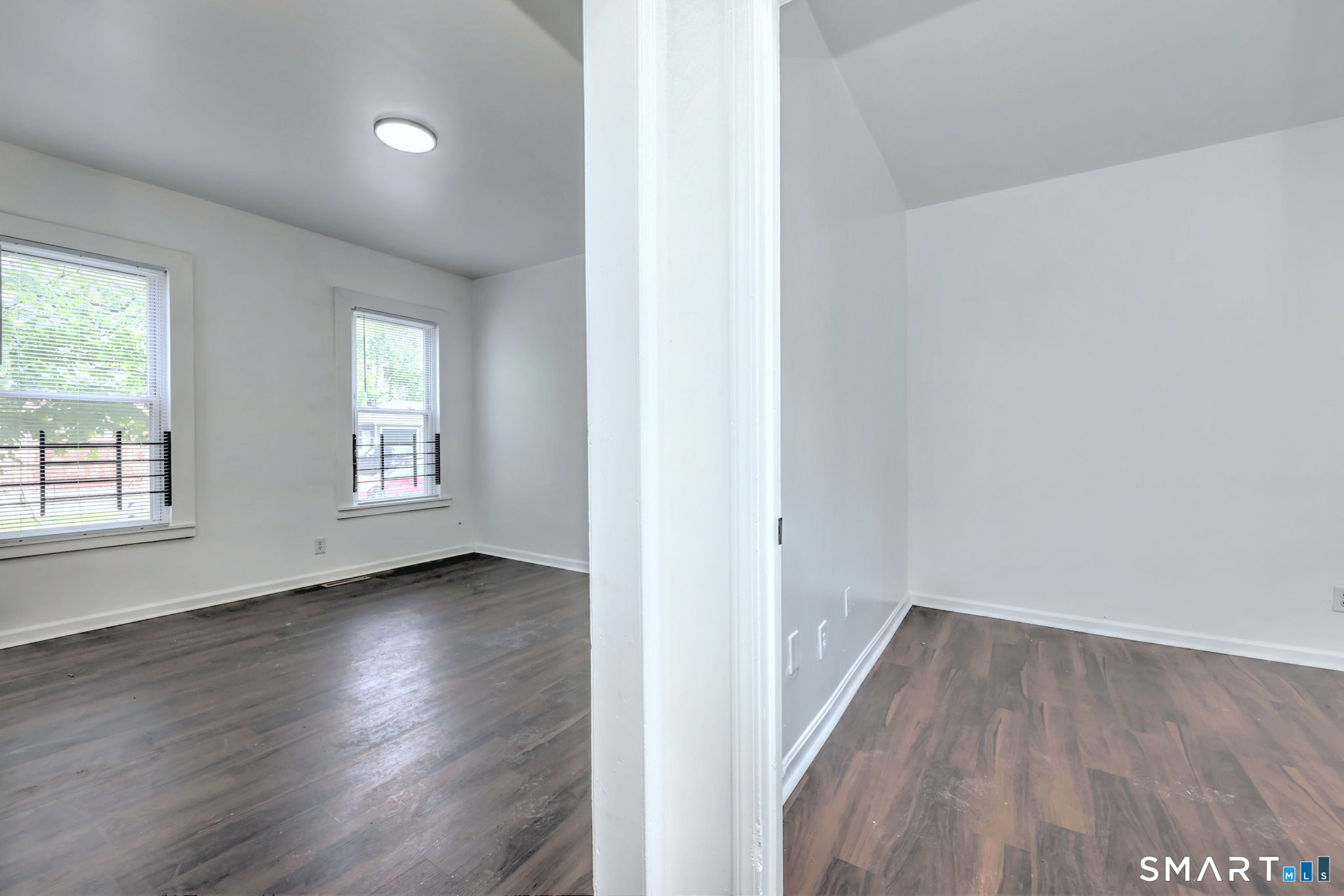 483 Ferry Street, Unit 1 New Haven, CT 06513 - Photo 7 of 33 an empty room with wooden floor and windows