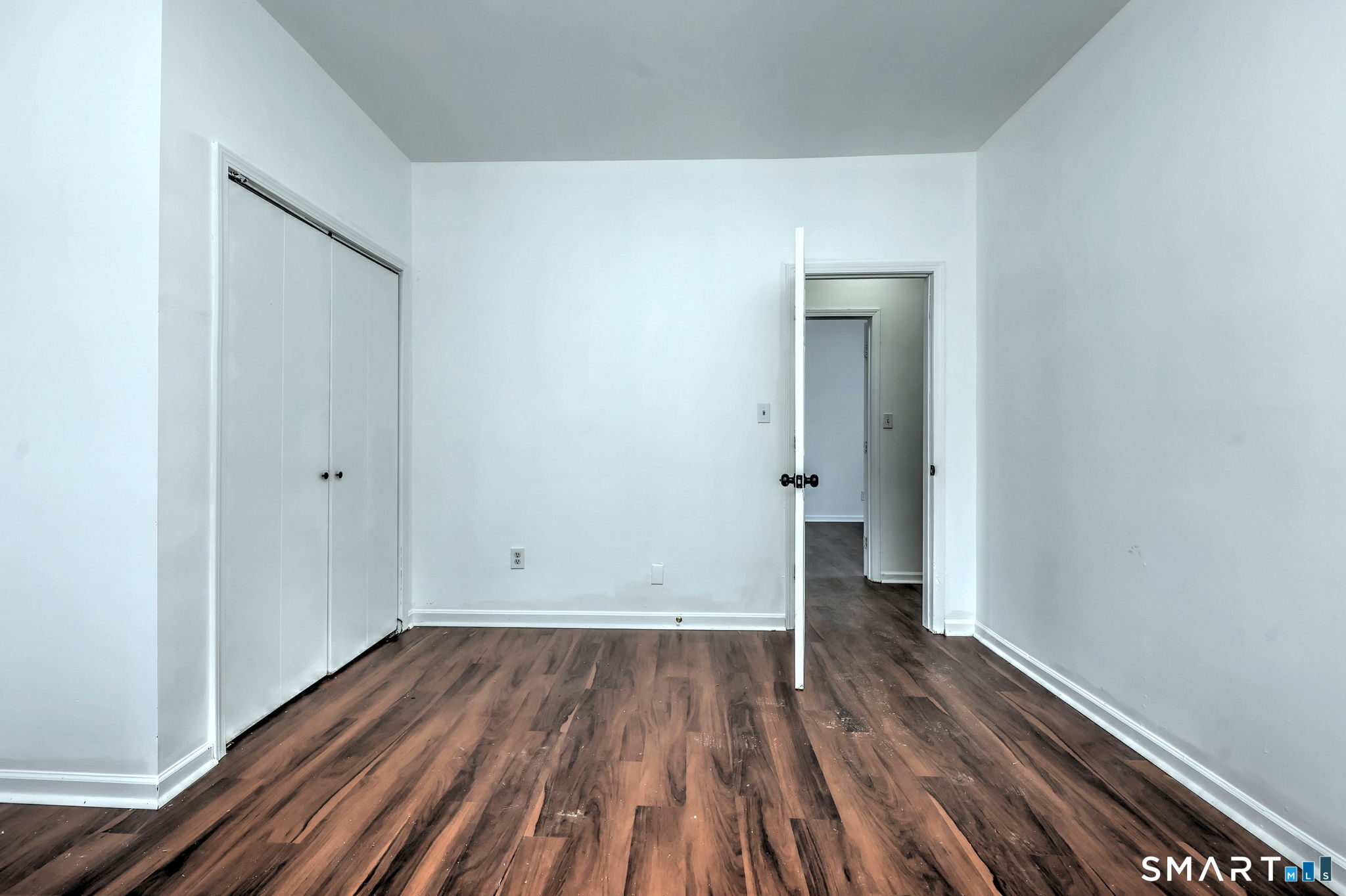 483 Ferry Street, Unit 1 New Haven, CT 06513 - Photo 9 of 33 a view of a room with wooden floor and a window
