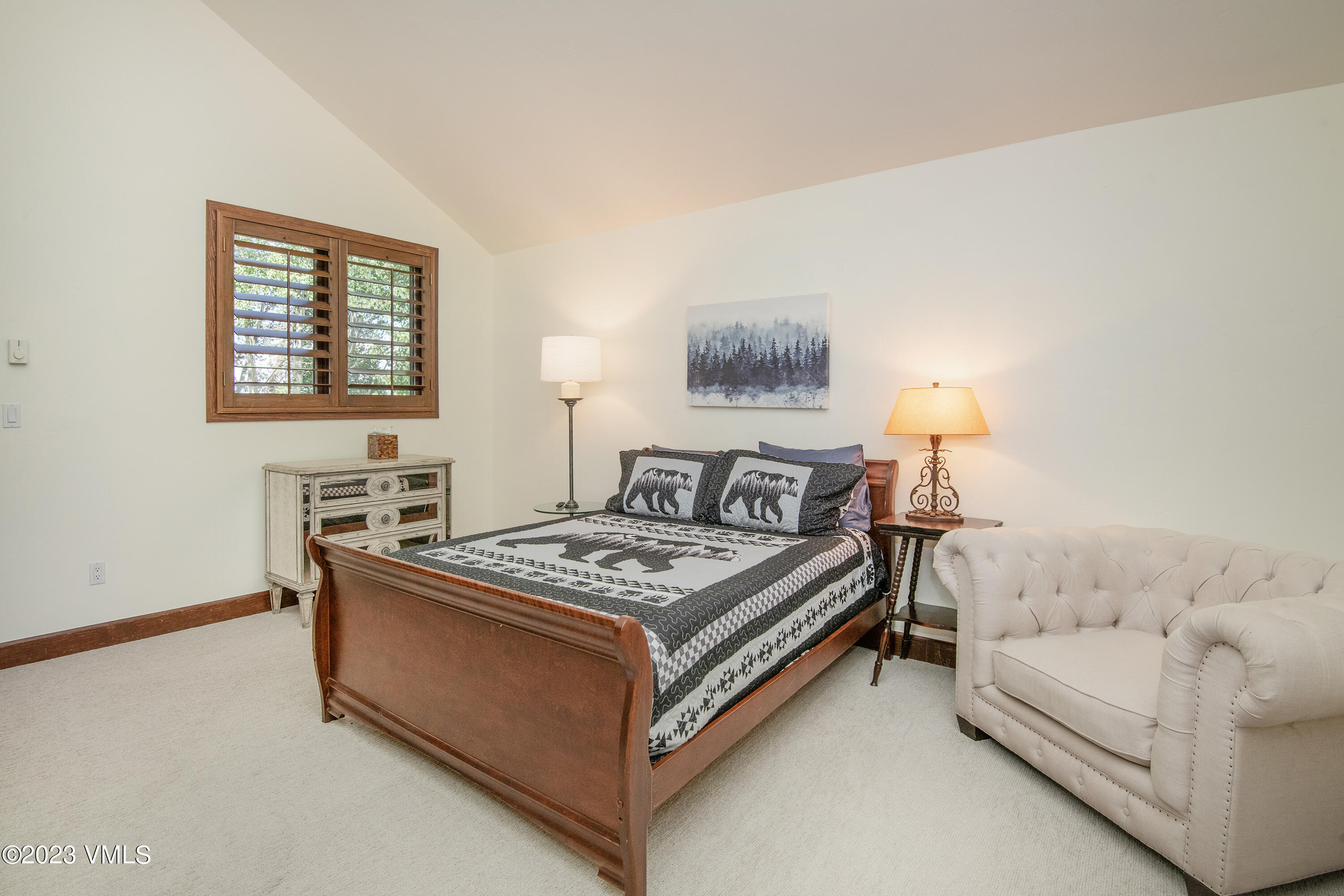 850 Eagle Drive Eagle-Vail, CO 81620 - Photo 8 of 11 a spacious bedroom with a bed and a couch
