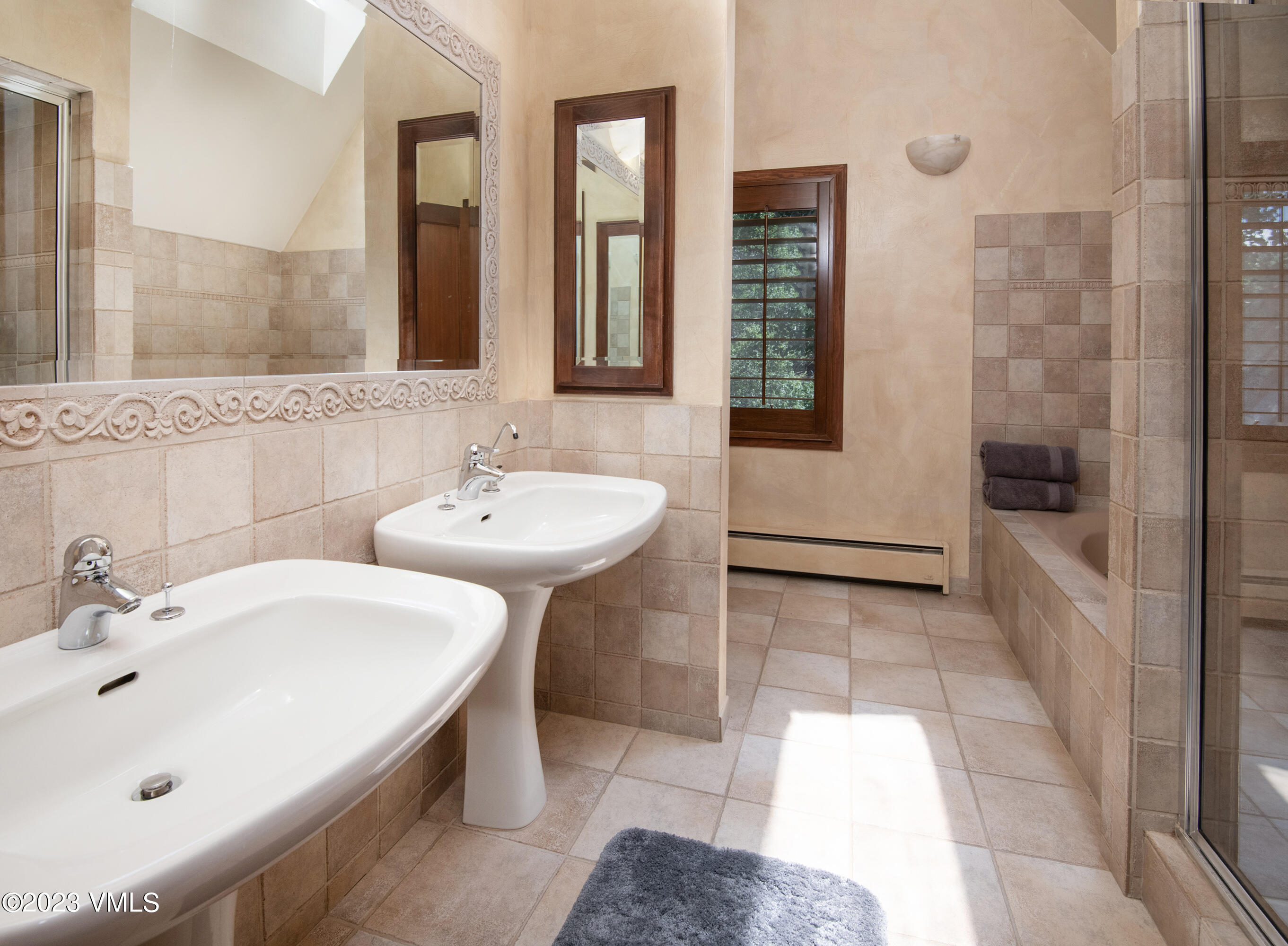 850 Eagle Drive Eagle-Vail, CO 81620 - Photo 9 of 11 a bathroom with a sink and a mirror