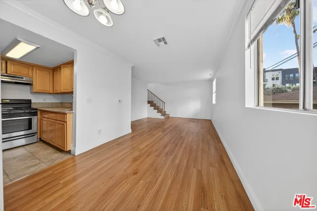 a view of kitchen and wooden floor