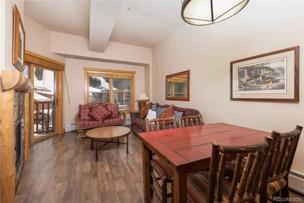 a view of a dining room with furniture and wooden floor