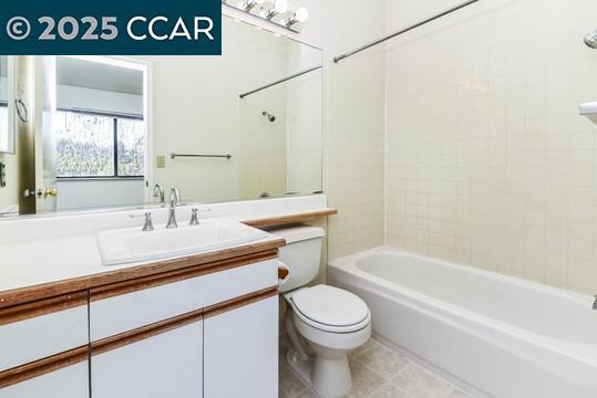 1300 Walden Road Walnut Creek, CA 94597 - Photo 22 of 52 a bathroom with a sink a toilet and shower
