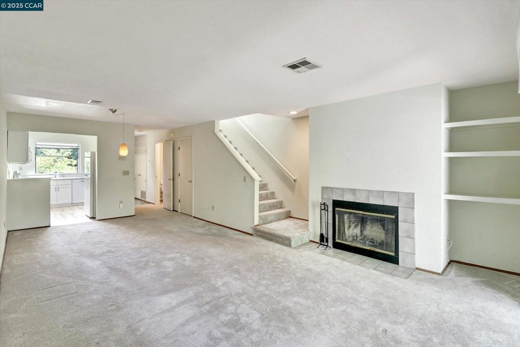 1300 Walden Road Walnut Creek, CA 94597 - Photo 23 of 52 an empty room with furniture and a fireplace