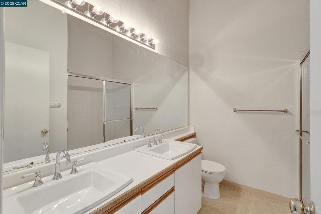 1300 Walden Road Walnut Creek, CA 94597 - Photo 28 of 52 a bathroom with a sink and a mirror
