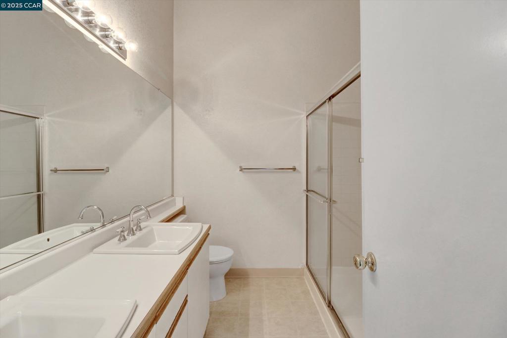 1300 Walden Road Walnut Creek, CA 94597 - Photo 29 of 52 a bathroom with a sink a toilet and shower