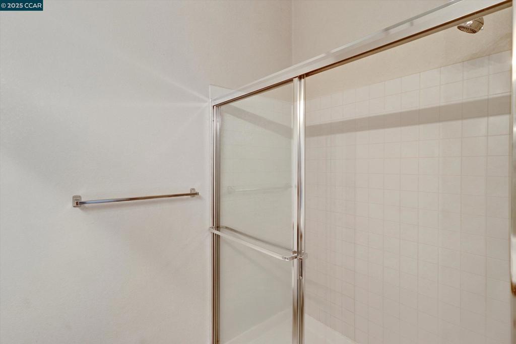 1300 Walden Road Walnut Creek, CA 94597 - Photo 30 of 52 a bathroom with a glass shower door
