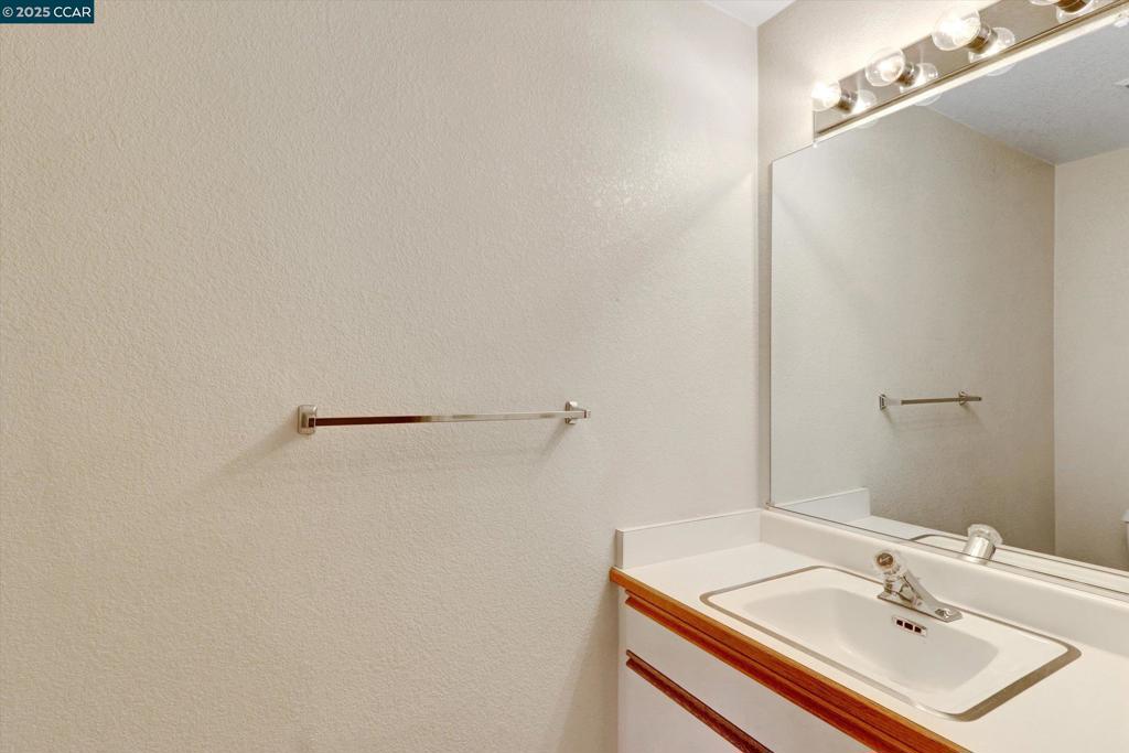 1300 Walden Road Walnut Creek, CA 94597 - Photo 39 of 52 a bathroom with a sink and a mirror
