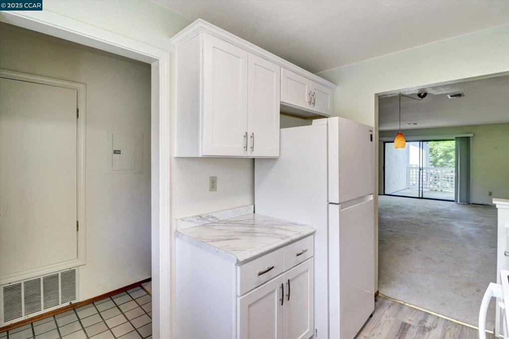 1300 Walden Road Walnut Creek, CA 94597 - Photo 6 of 52 a kitchen with stainless steel appliances granite countertop a refrigerator and a stove
