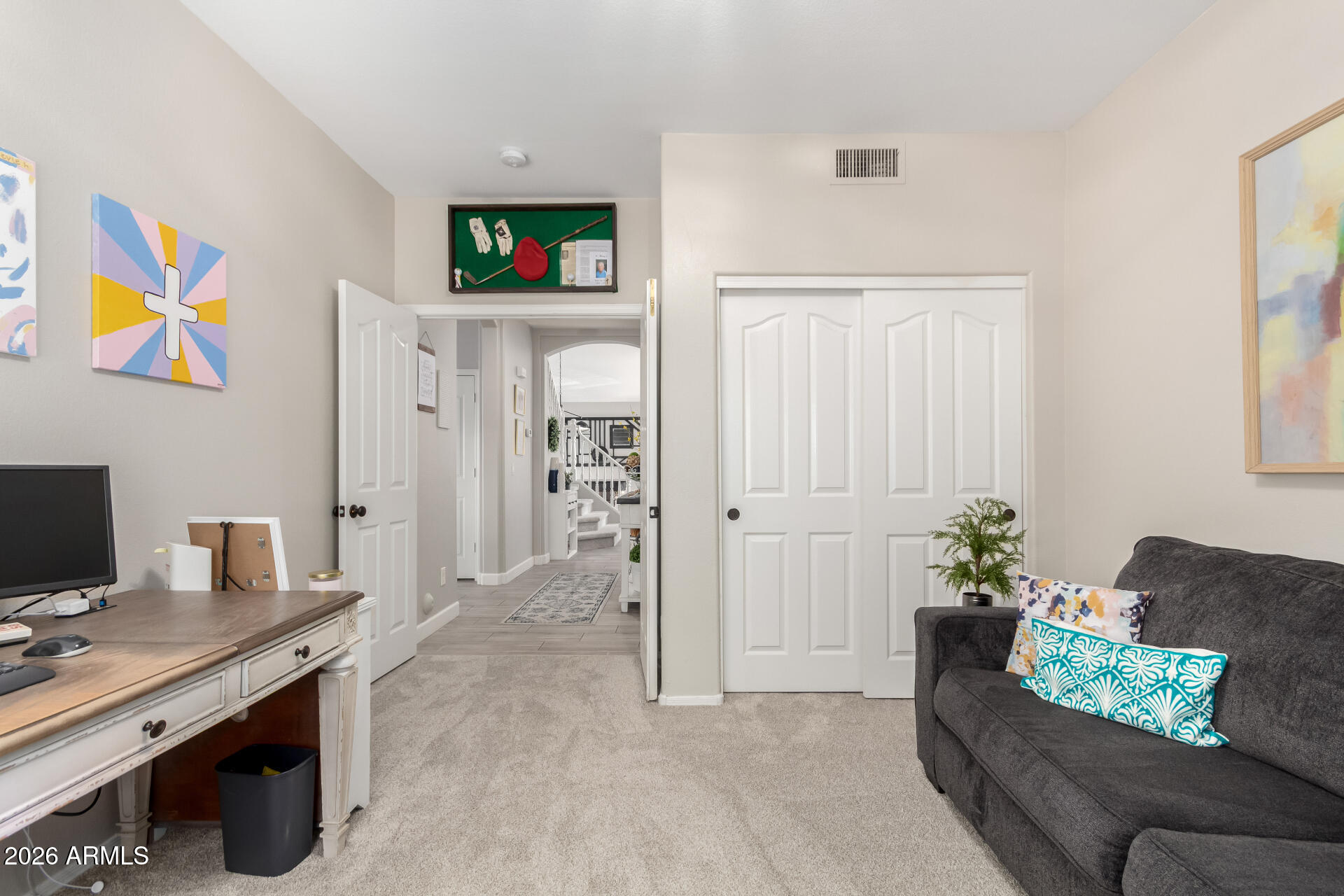 240 East Gail Court Gilbert, AZ 85296 - Photo 17 of 49 a living room with furniture and a flat screen tv