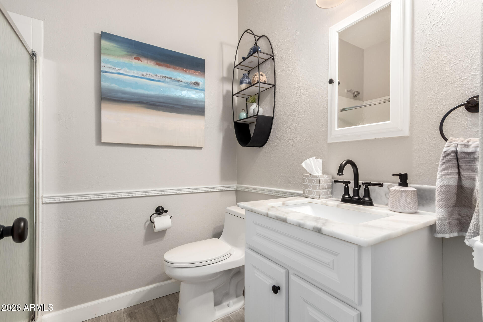 240 East Gail Court Gilbert, AZ 85296 - Photo 18 of 49 a bathroom with a toilet sink and mirror