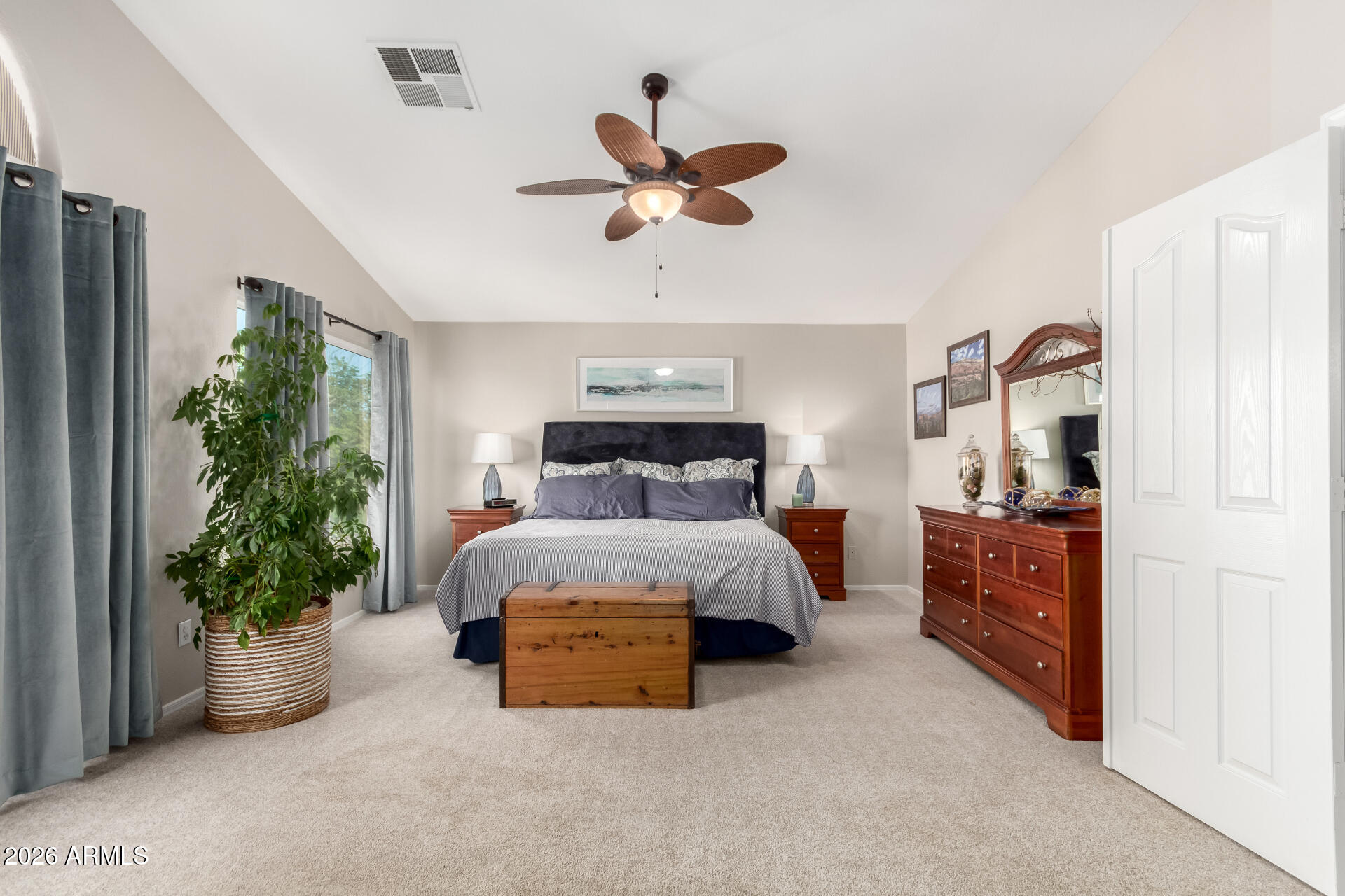 240 East Gail Court Gilbert, AZ 85296 - Photo 22 of 49 a bed room with a bed and a chandelier