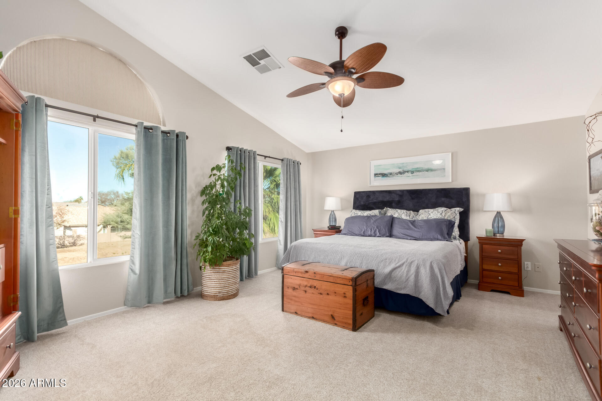 240 East Gail Court Gilbert, AZ 85296 - Photo 23 of 49 a spacious bedroom with a bed and a chandelier