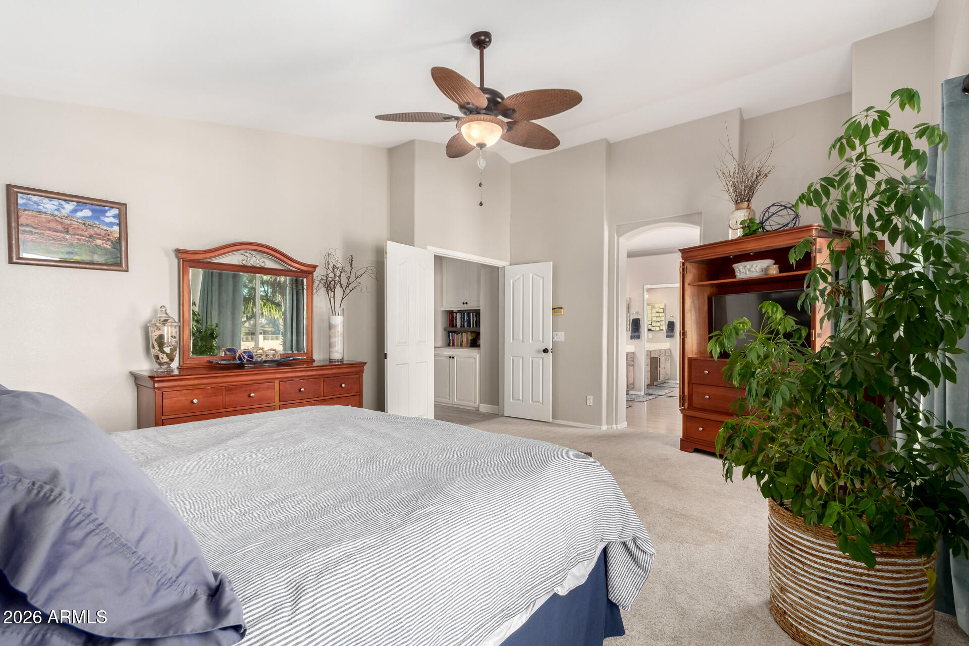 240 East Gail Court Gilbert, AZ 85296 - Photo 24 of 49 a bedroom with a bed chandelier and a window