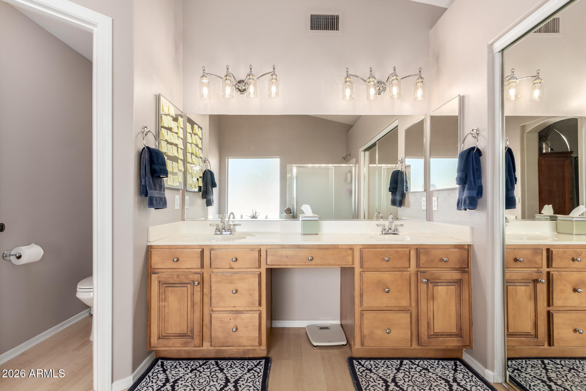 240 East Gail Court Gilbert, AZ 85296 - Photo 26 of 49 a spacious bathroom with a granite countertop sink a mirror and a toilet