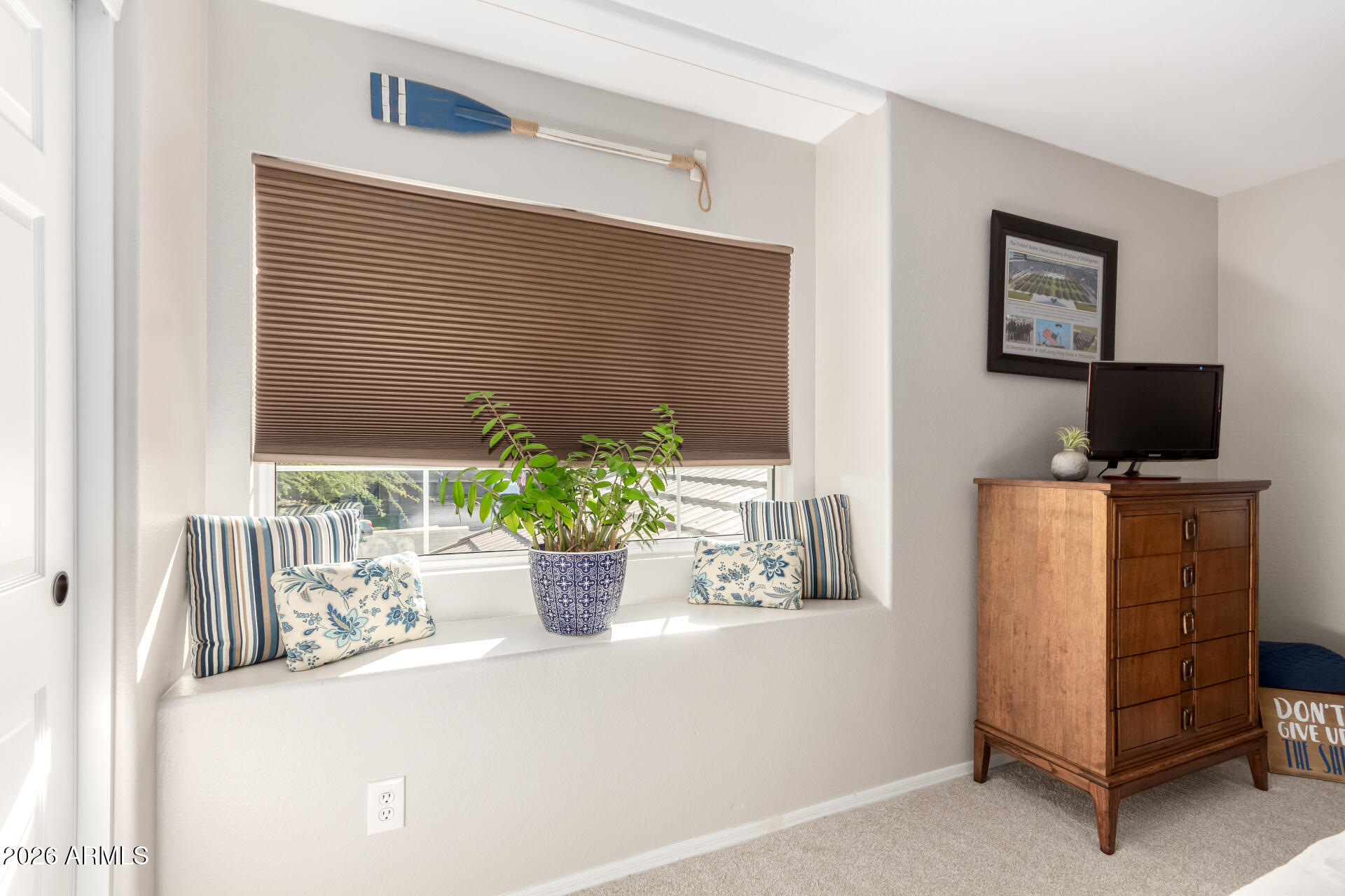 240 East Gail Court Gilbert, AZ 85296 - Photo 31 of 49 a potted plant sitting on top of a wooden table