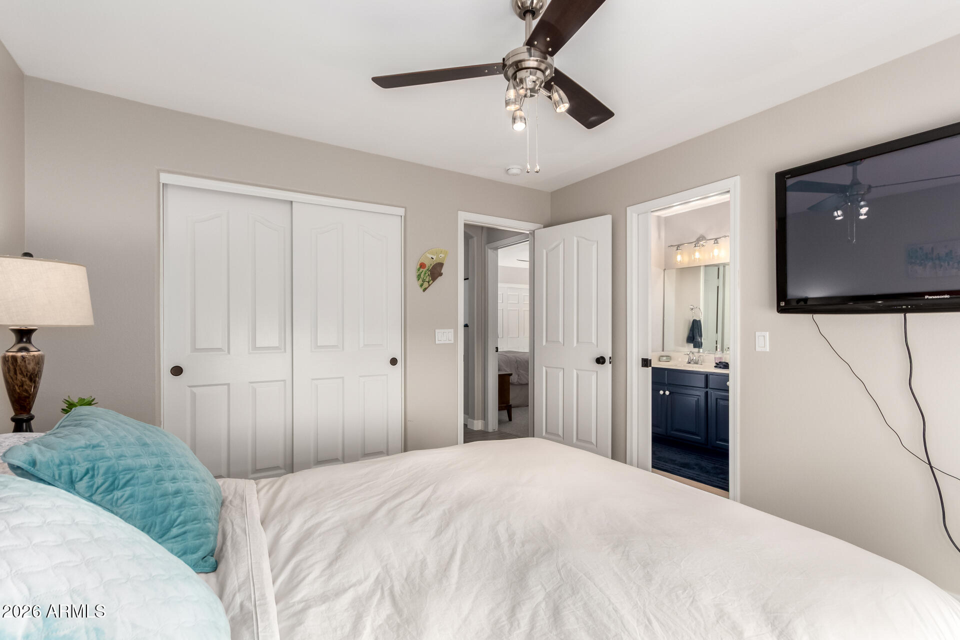 240 East Gail Court Gilbert, AZ 85296 - Photo 33 of 49 a bedroom with a bed and a flat tv screen on dresser