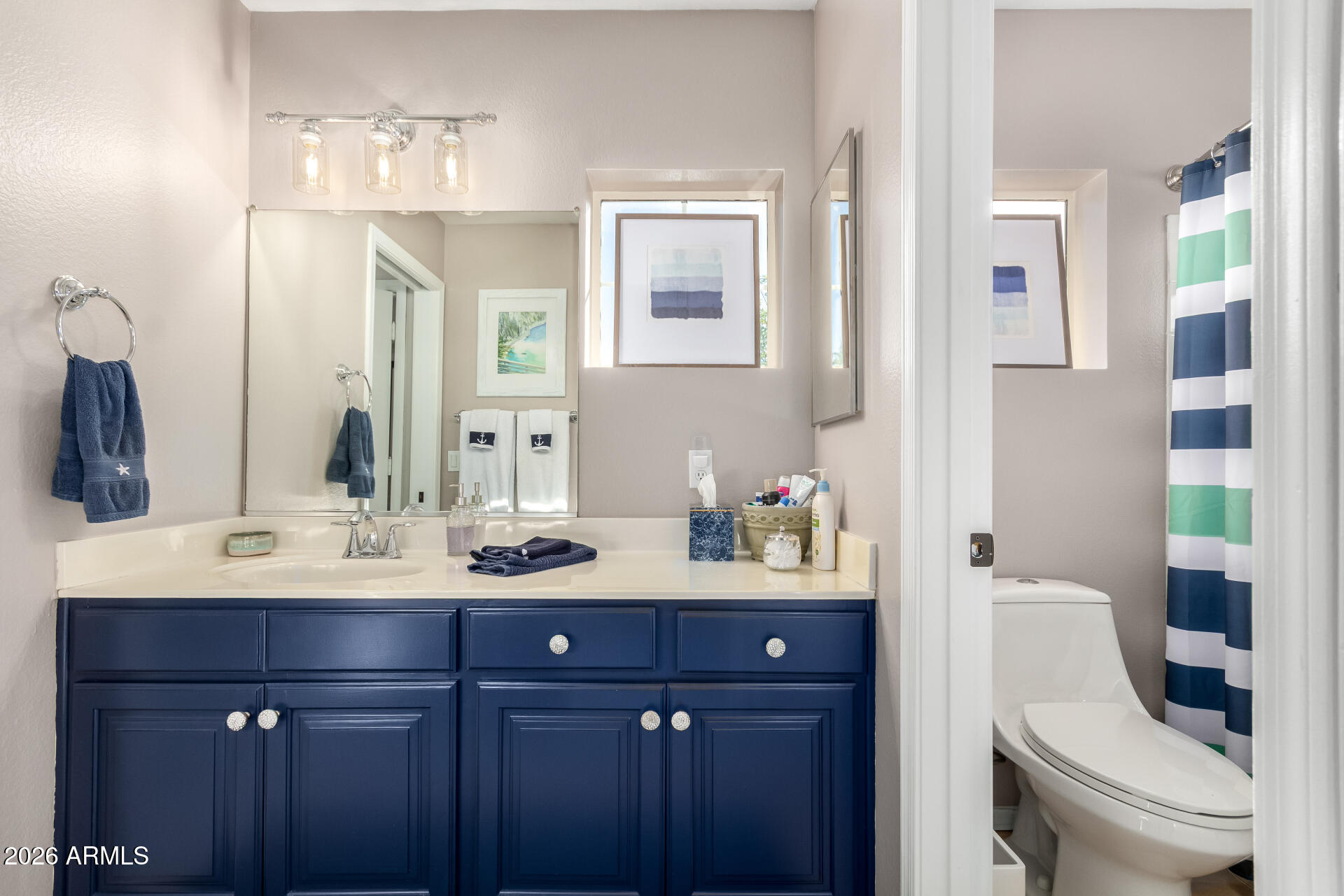 240 East Gail Court Gilbert, AZ 85296 - Photo 34 of 49 a bathroom with a double vanity sink and a mirror