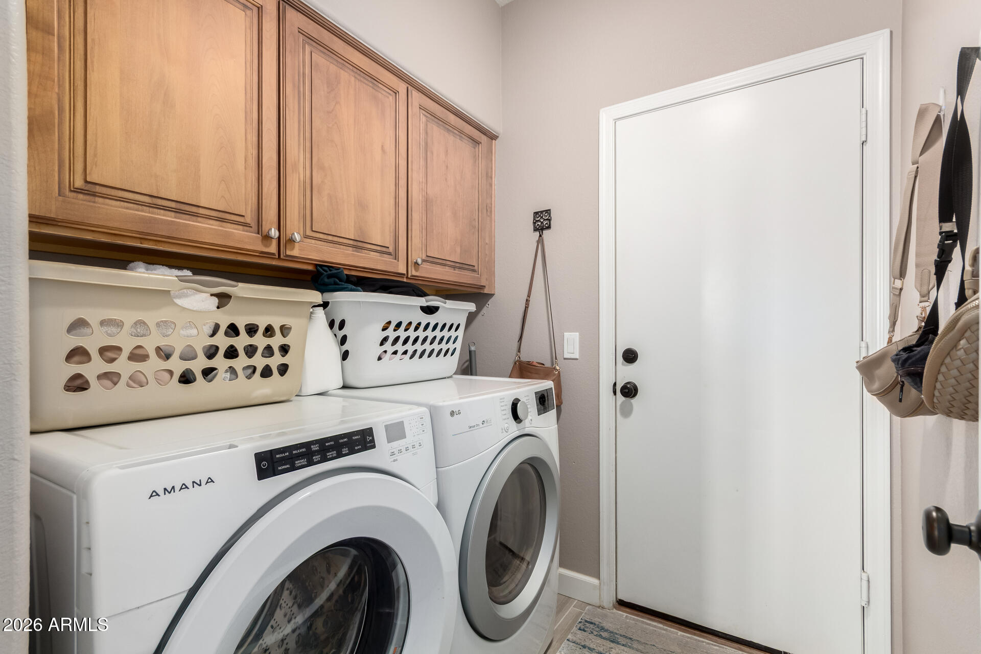 240 East Gail Court Gilbert, AZ 85296 - Photo 37 of 49 a view of washer and dryer with kitchen in the background