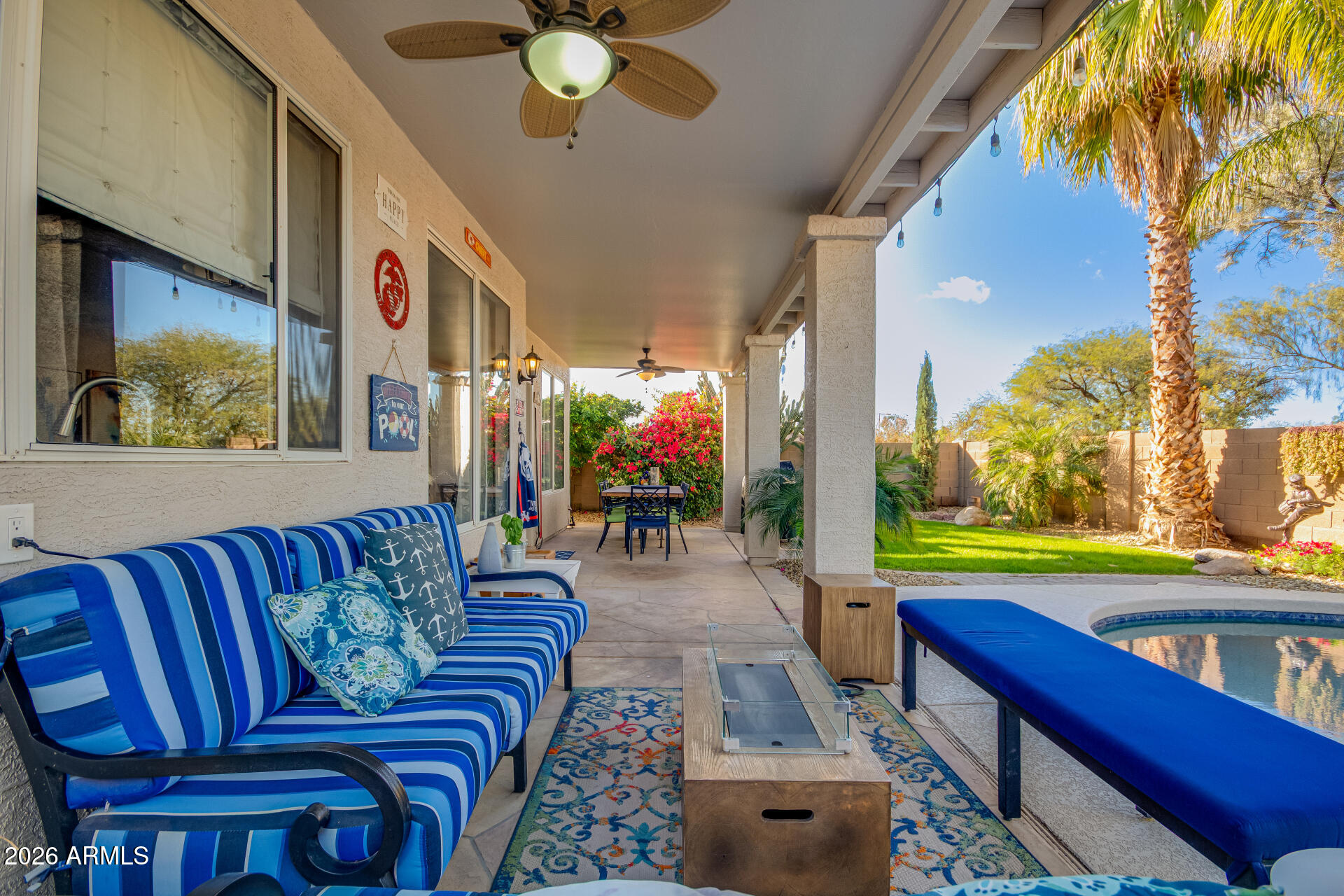 240 East Gail Court Gilbert, AZ 85296 - Photo 41 of 49 a living room with patio furniture and a potted plant
