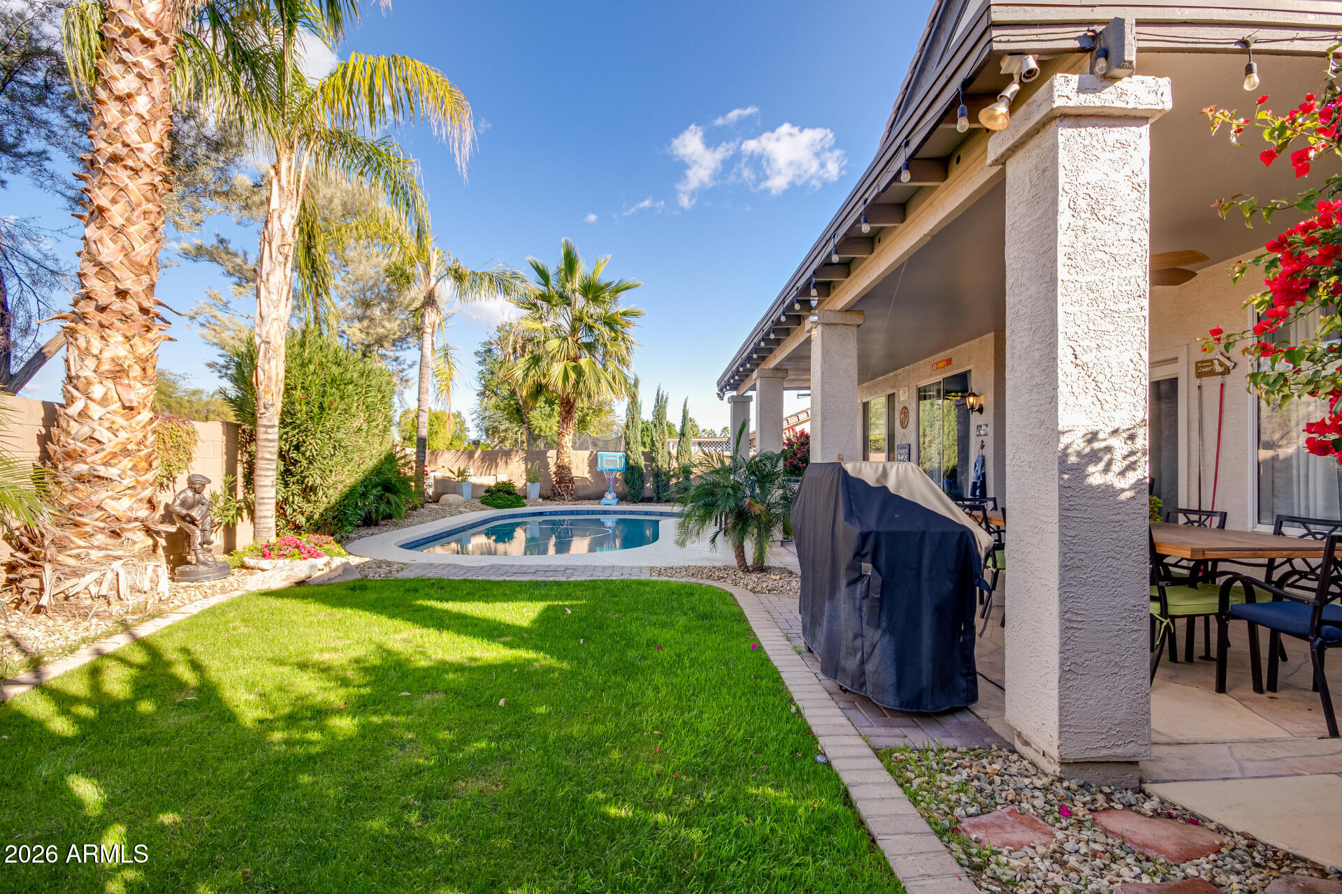 240 East Gail Court Gilbert, AZ 85296 - Photo 43 of 49 a view of swimming pool with outdoor seating and a patio