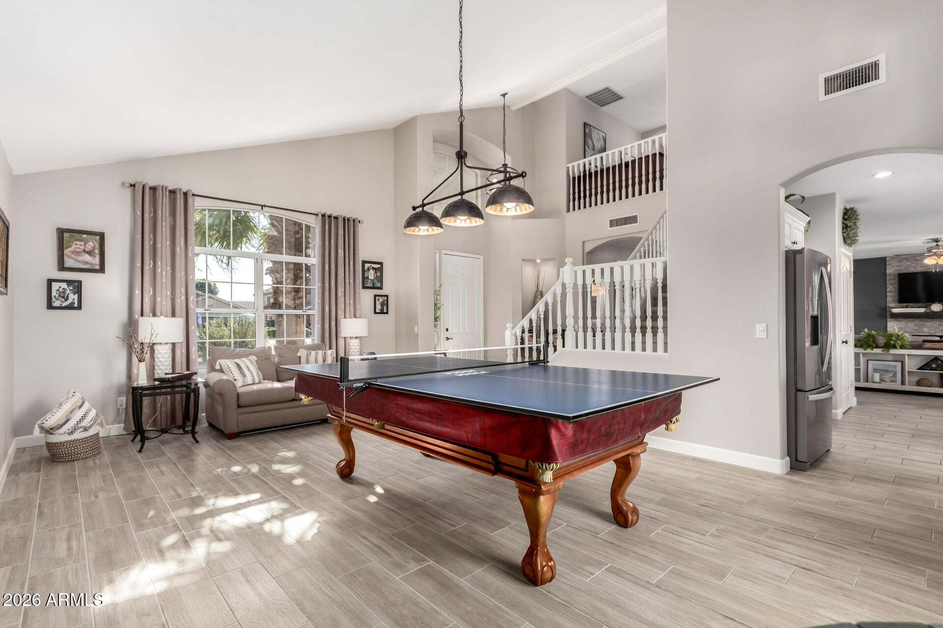 240 East Gail Court Gilbert, AZ 85296 - Photo 5 of 49 a living room with furniture a table and a large window