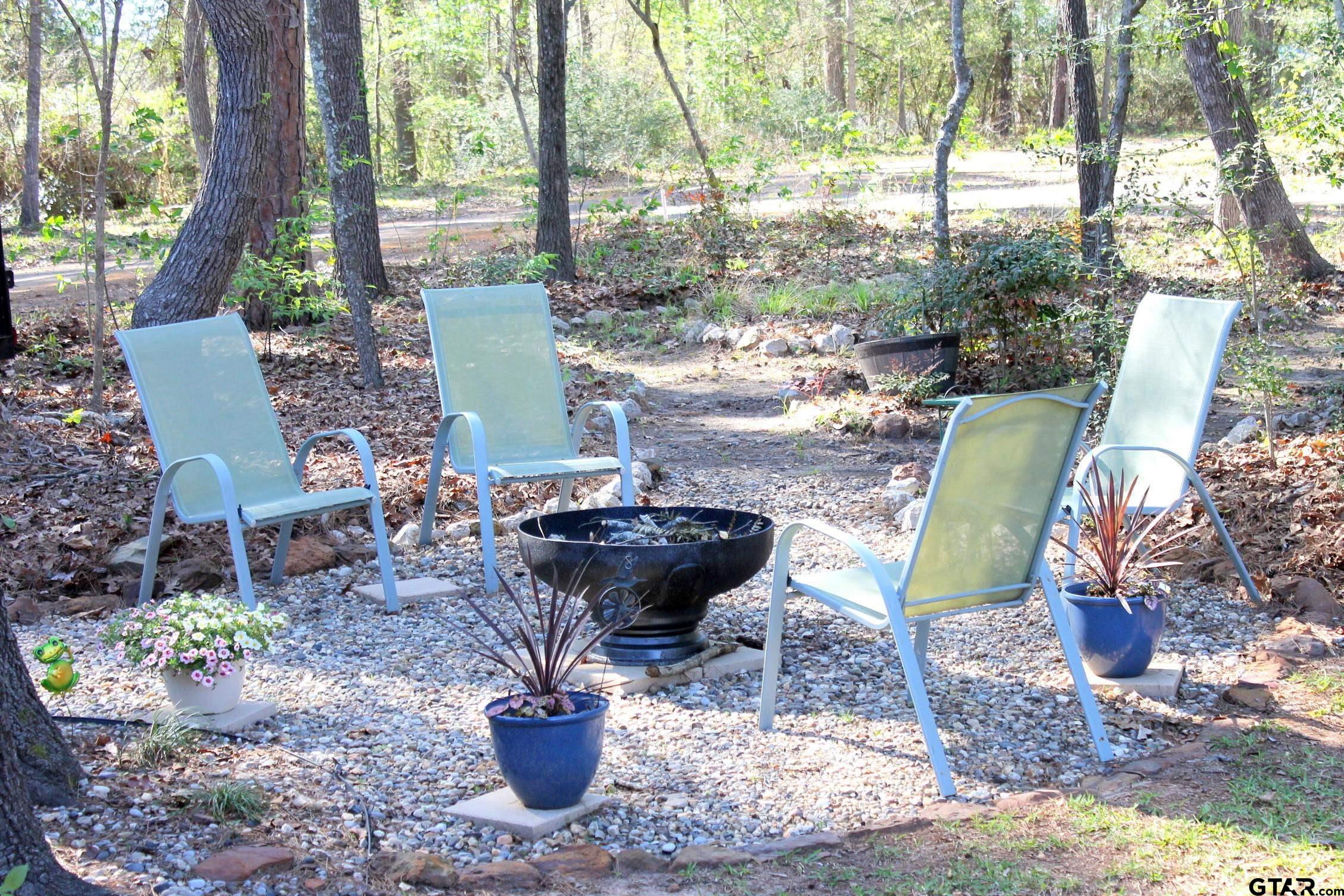 289 Acapulco Road Jefferson, TX 75657 - Photo 22 of 30 a view of a backyard with garden and furniture
