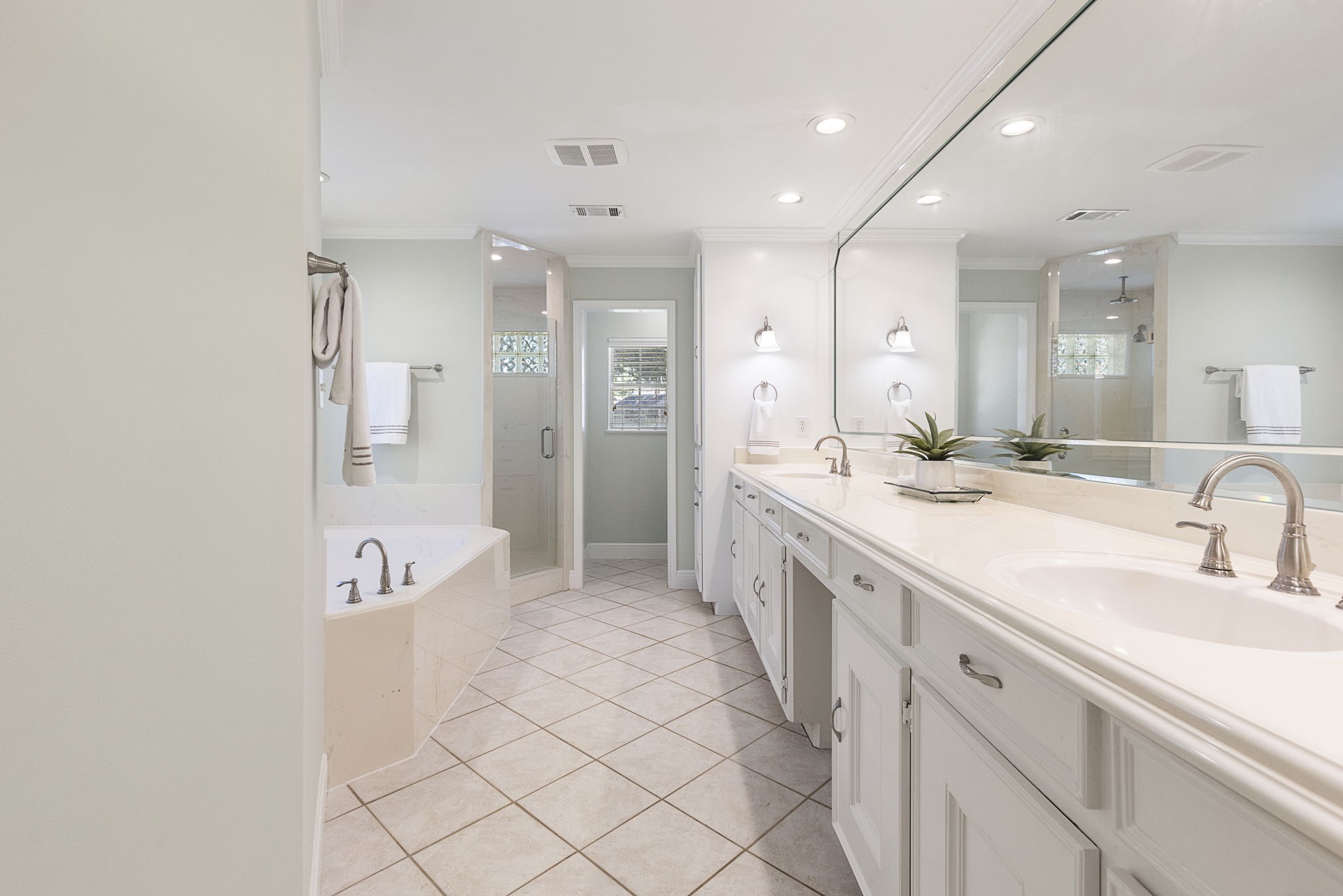 17706 Asphodel Lane Spring, TX 77379 - Photo 11 of 48 a spacious bathroom with a double vanity sink mirror and shower