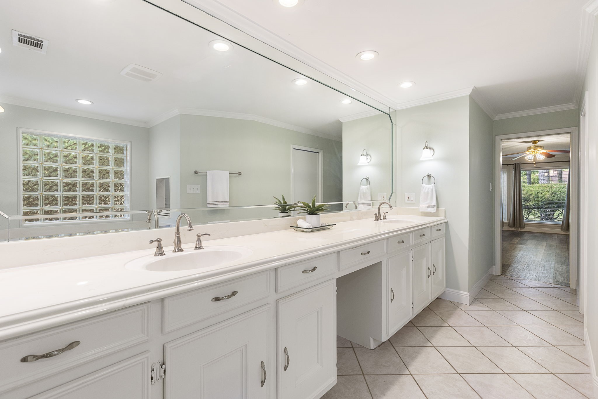 17706 Asphodel Lane Spring, TX 77379 - Photo 12 of 48 a spacious bathroom with a double vanity sink mirror and next to a window