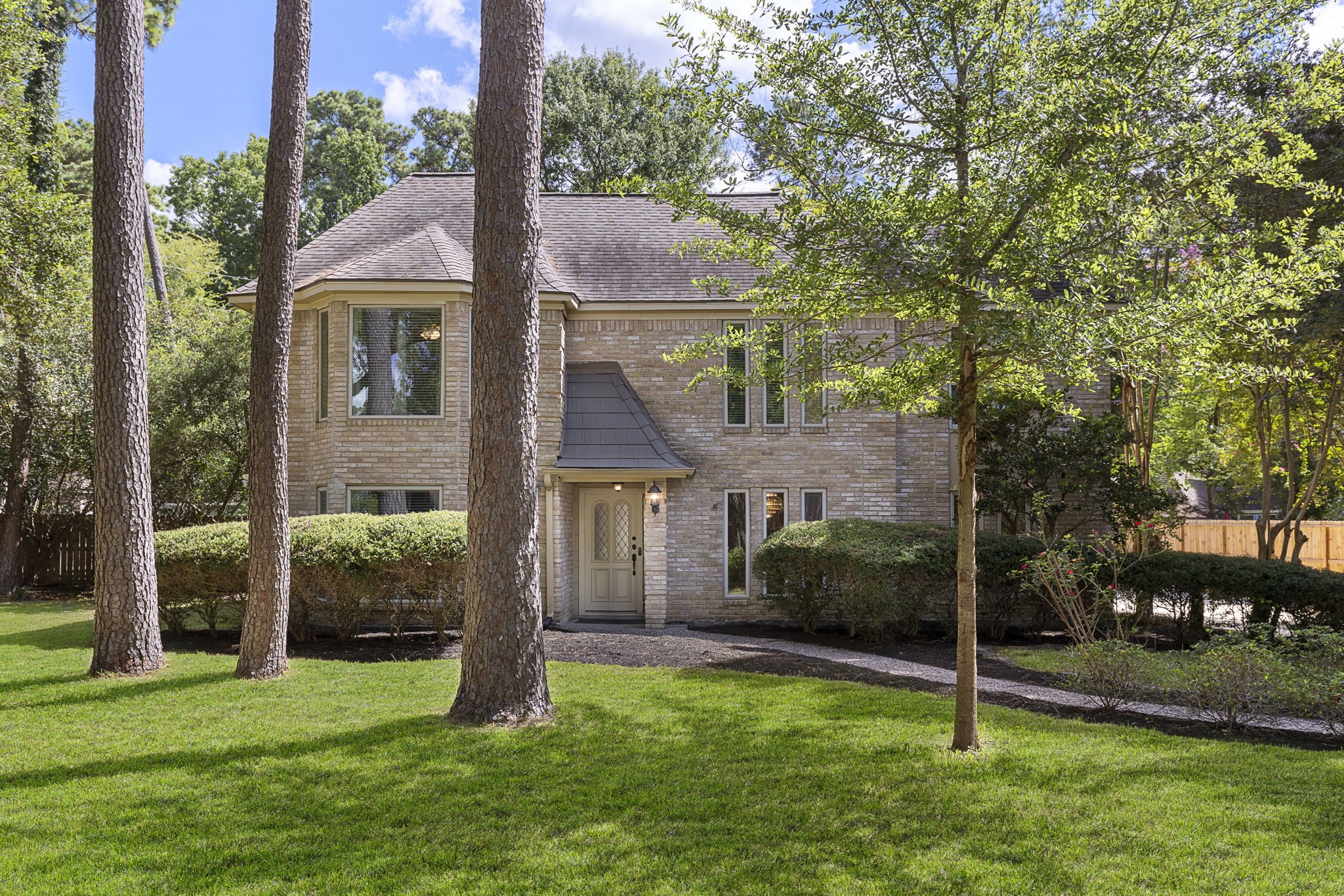 17706 Asphodel Lane Spring, TX 77379 - Photo 2 of 48 a front view of a house with a yard and garage