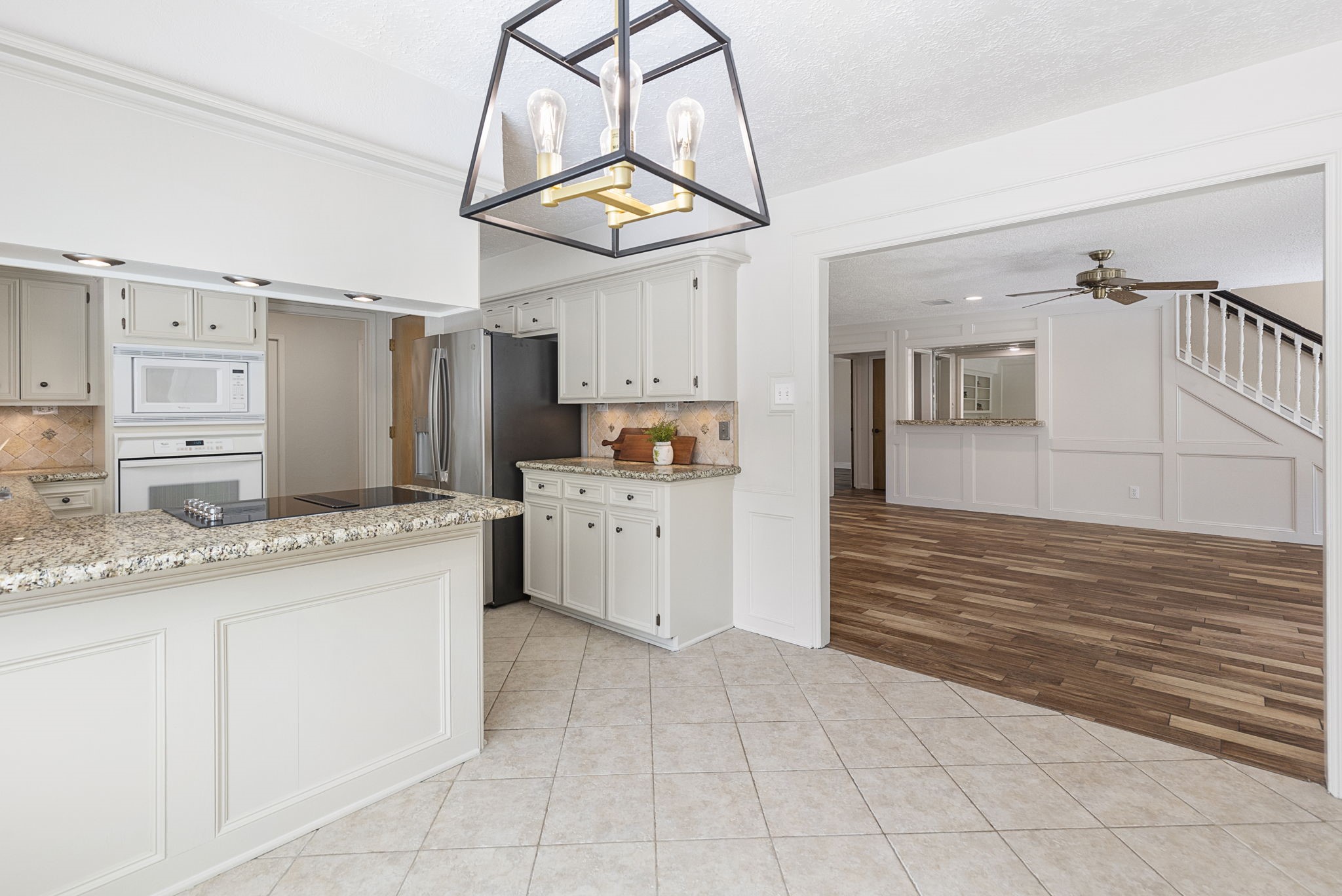 17706 Asphodel Lane Spring, TX 77379 - Photo 24 of 48 View of the kitchen and living room from the dining room.