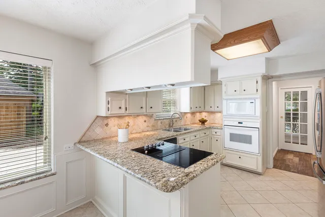 a picture of a bathroom with a shower