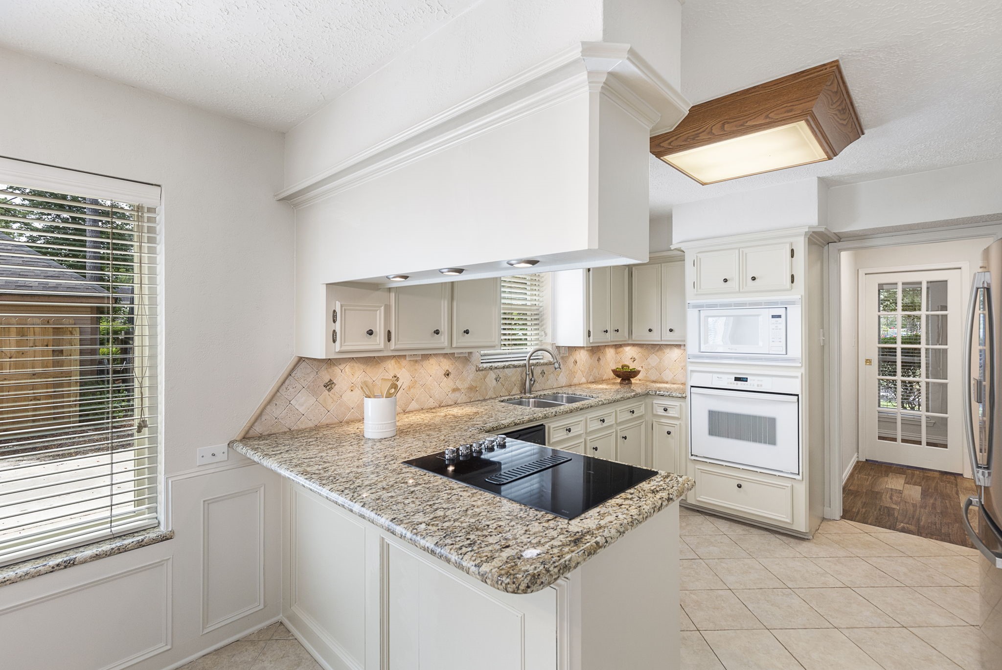 17706 Asphodel Lane Spring, TX 77379 - Photo 25 of 48 a kitchen with stainless steel appliances granite countertop a sink stove and refrigerator
