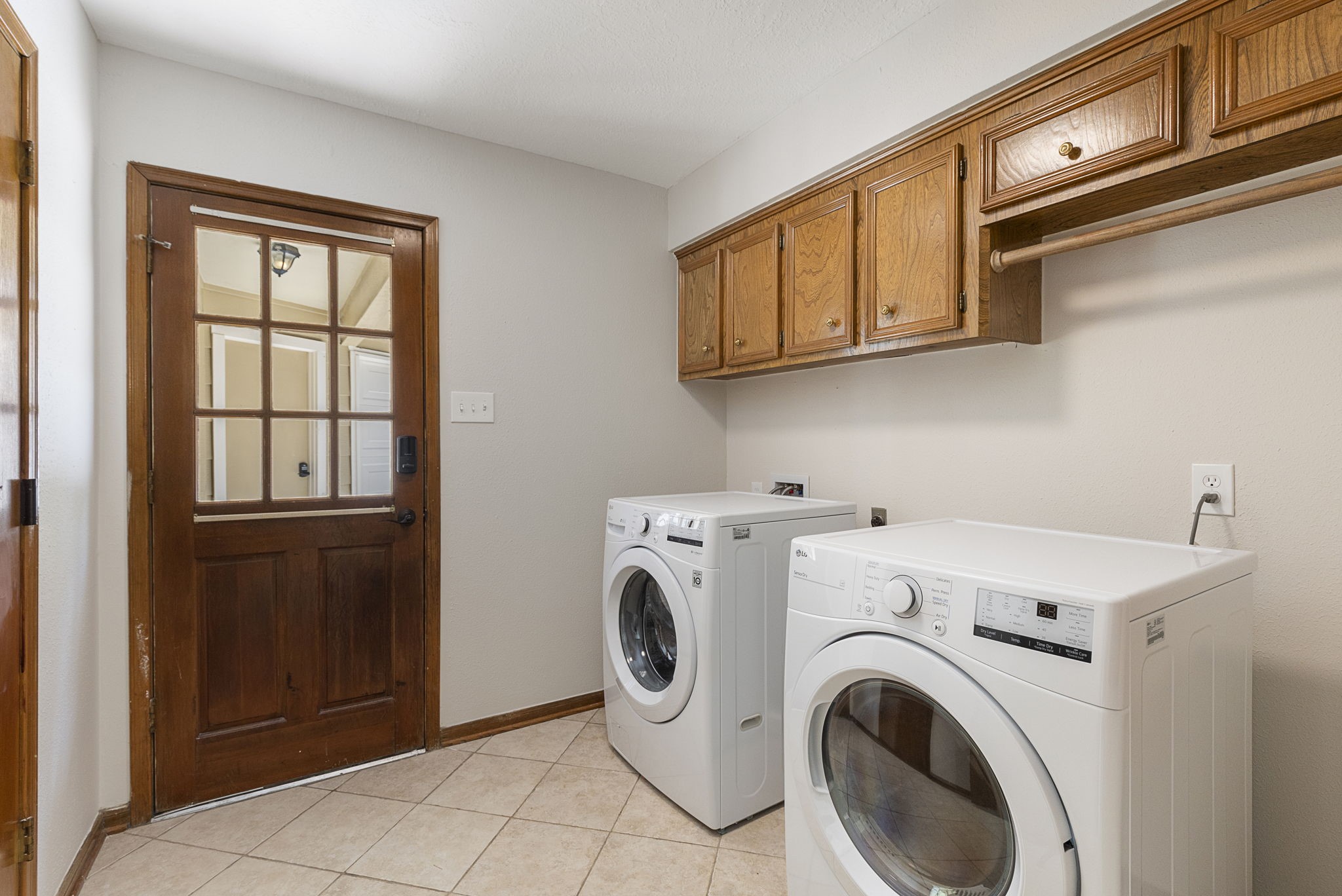 17706 Asphodel Lane Spring, TX 77379 - Photo 29 of 48 Lots of storage in the utility room with door to rear yard and detached garage