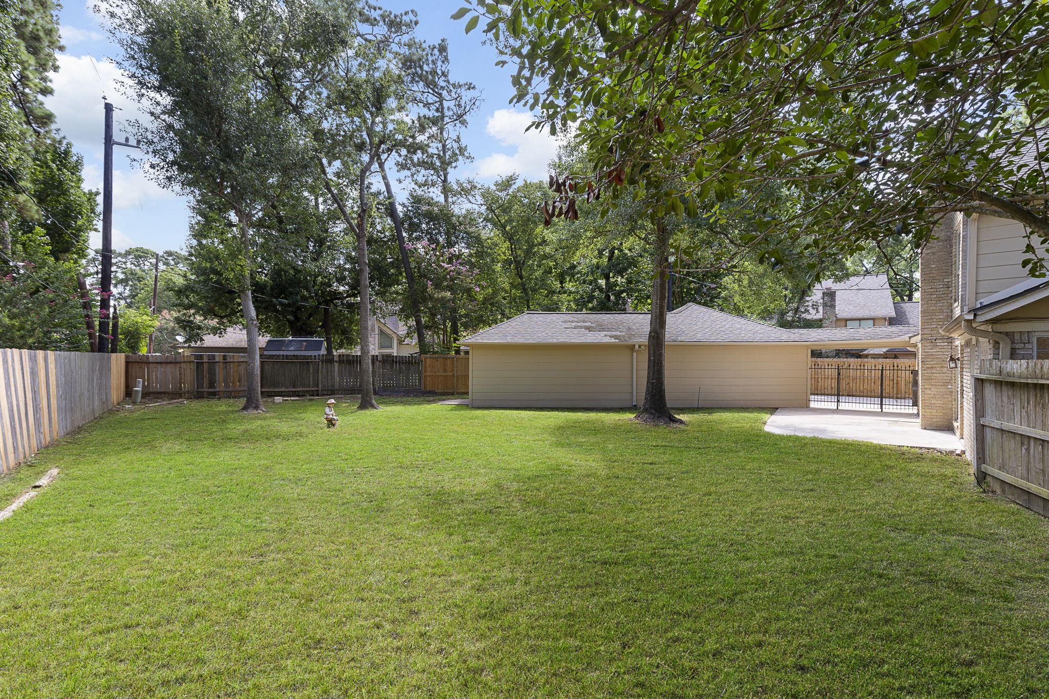 17706 Asphodel Lane Spring, TX 77379 - Photo 43 of 48 a view of a backyard with a garden and entertaining space