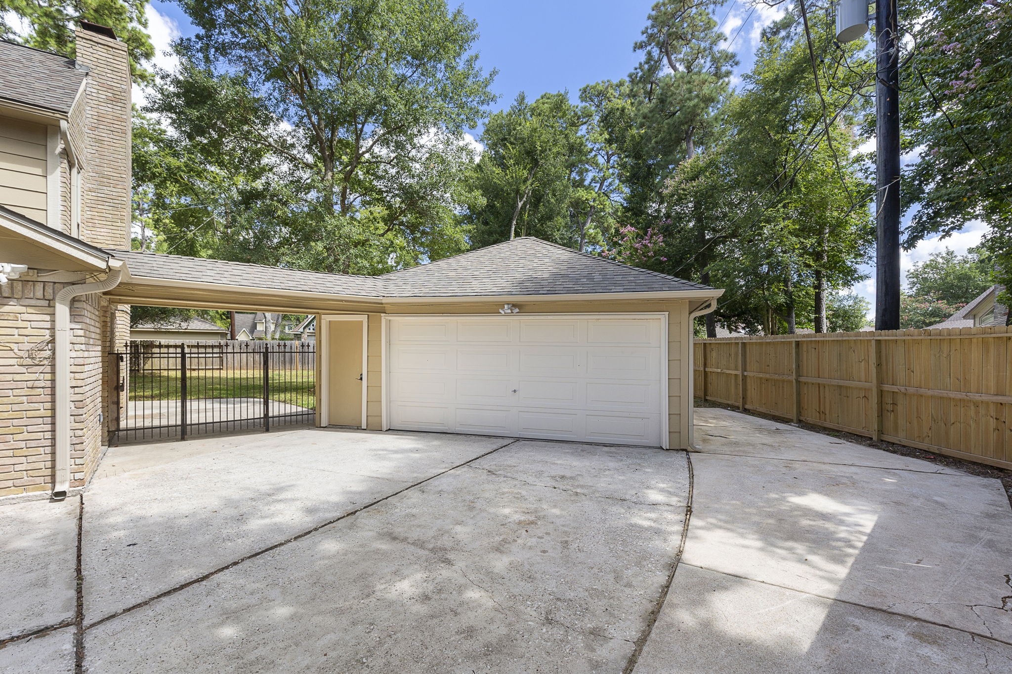 17706 Asphodel Lane Spring, TX 77379 - Photo 45 of 48 View leading to garage and gated patio