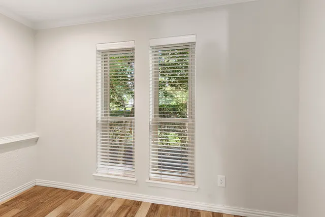 a spacious bathroom with a double vanity sink mirror and shower