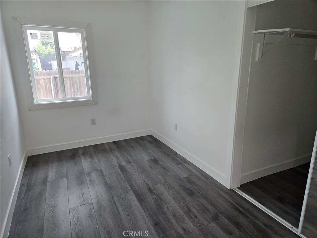 5327 Tyler Street, Unit A Riverside, CA 92503 - Photo 5 of 8 a view of a room that has wooden floor and window