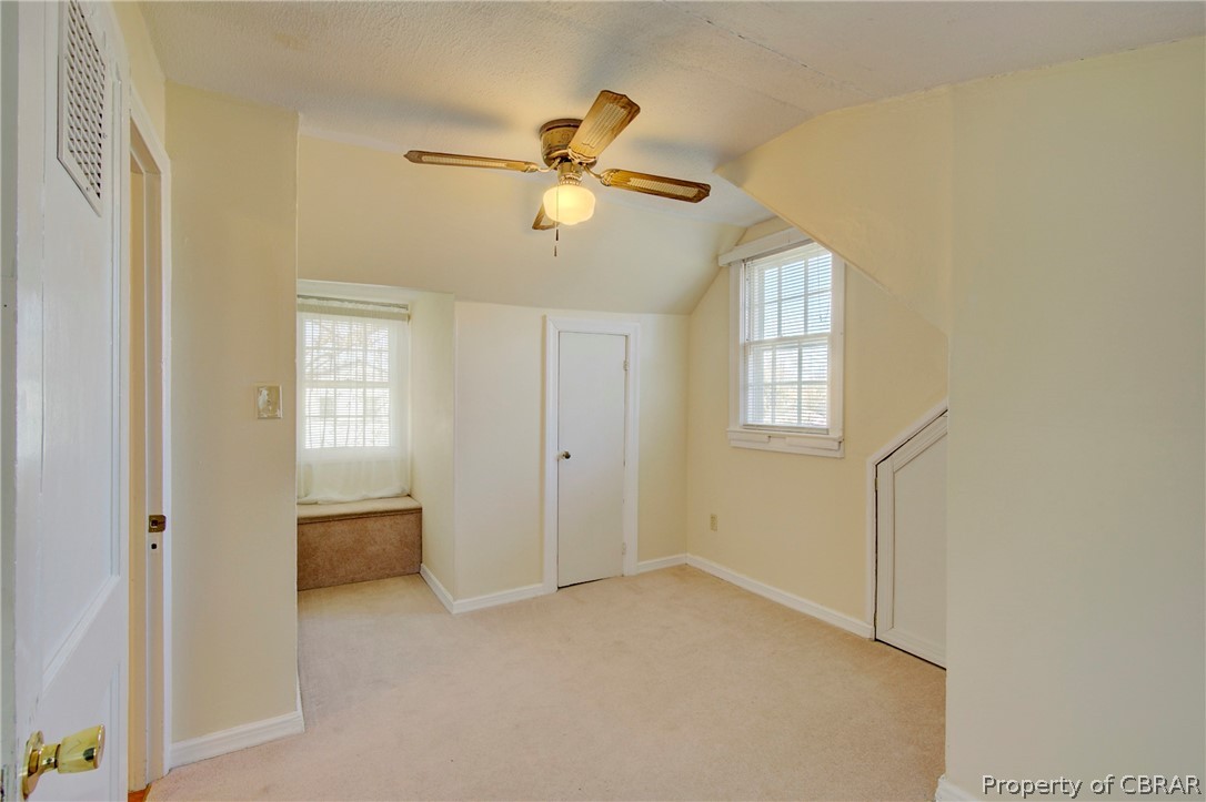 12 Old Meribeth Road Hampton, VA 23669 - Photo 27 of 32 Bonus room with vaulted ceiling, light colored carpet, and ceiling fan