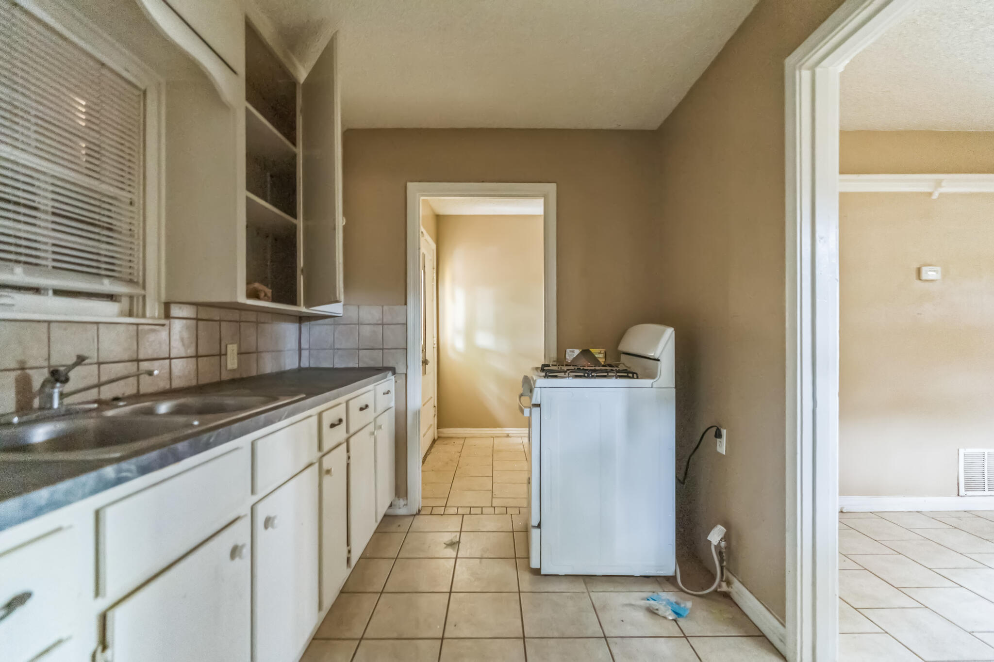 1510 33rd Street Lubbock, TX 79411 - Photo 17 of 33 a bathroom with a sink a mirror and a shower