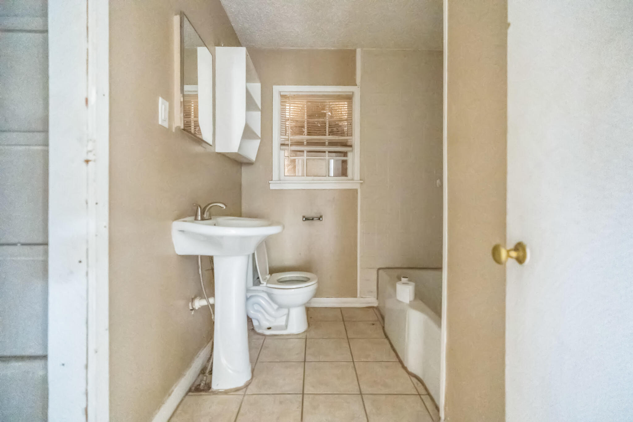 1510 33rd Street Lubbock, TX 79411 - Photo 19 of 33 a bathroom with a sink toilet and a mirror