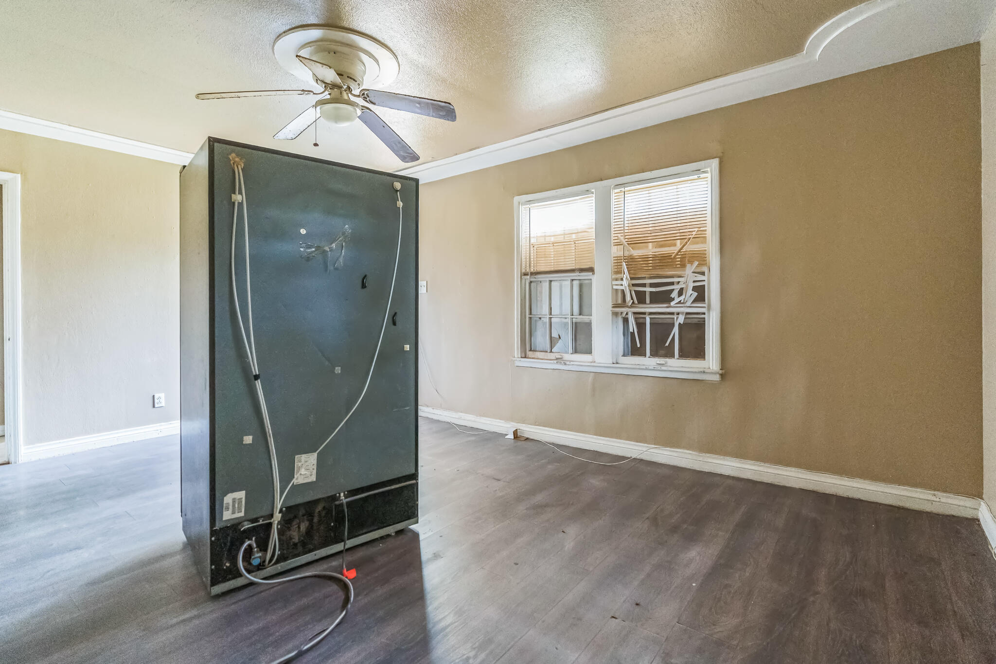 1510 33rd Street Lubbock, TX 79411 - Photo 22 of 33 a room with gym equipment and a window