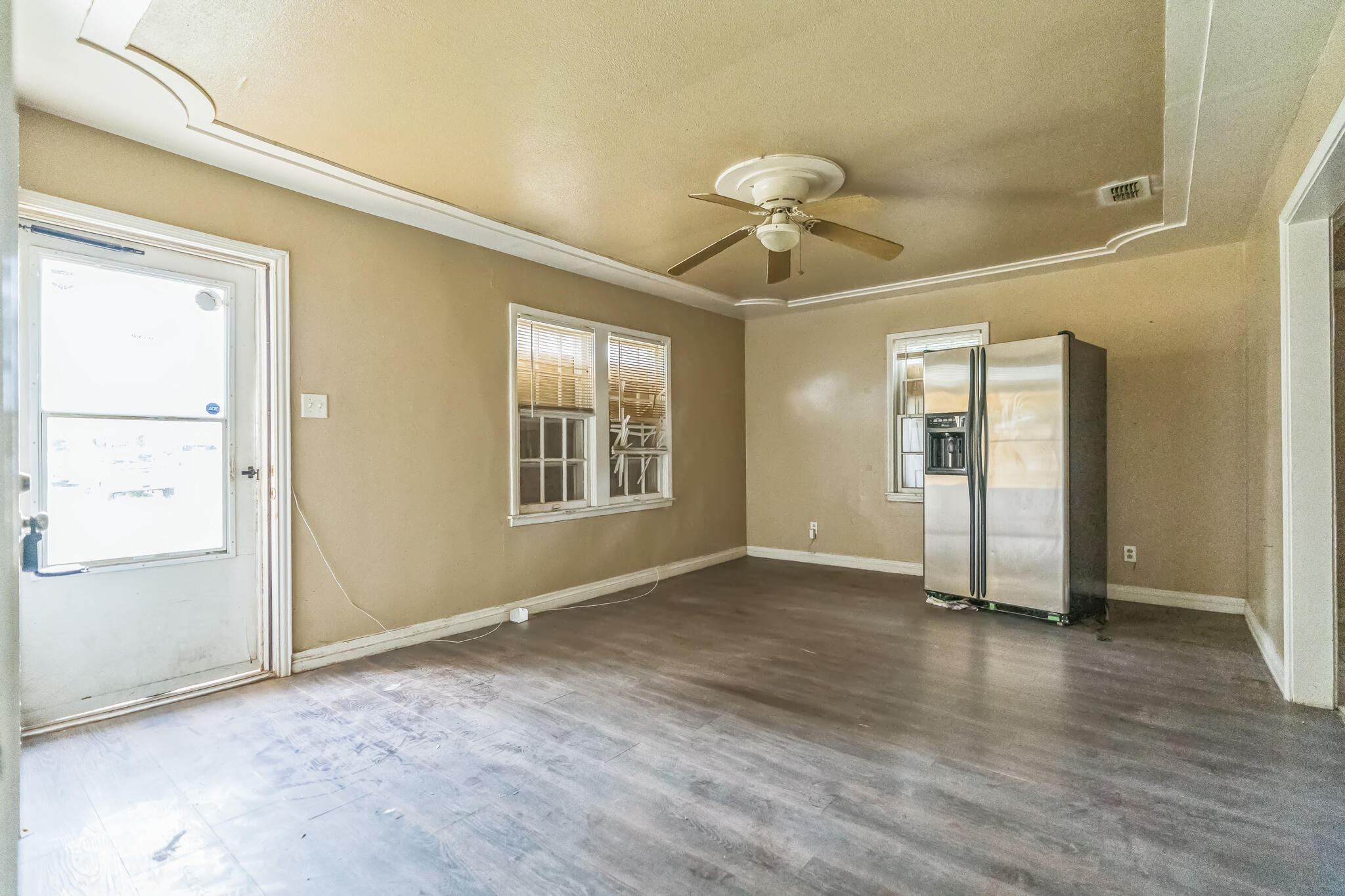 1510 33rd Street Lubbock, TX 79411 - Photo 25 of 33 an empty room with wooden floor and windows