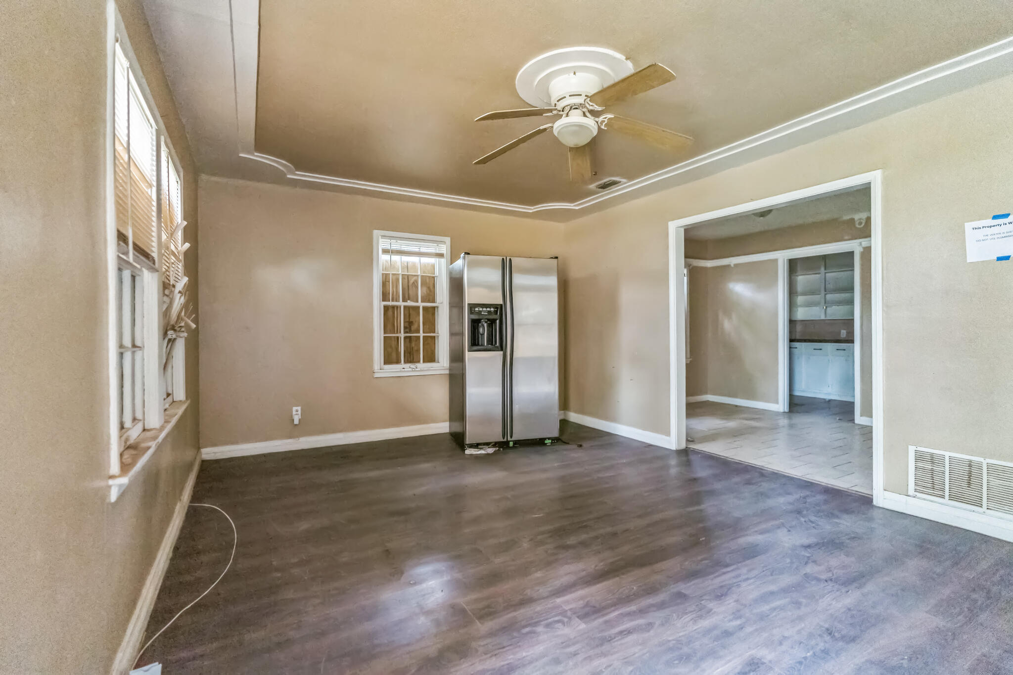1510 33rd Street Lubbock, TX 79411 - Photo 26 of 33 an empty room with wooden floor and windows