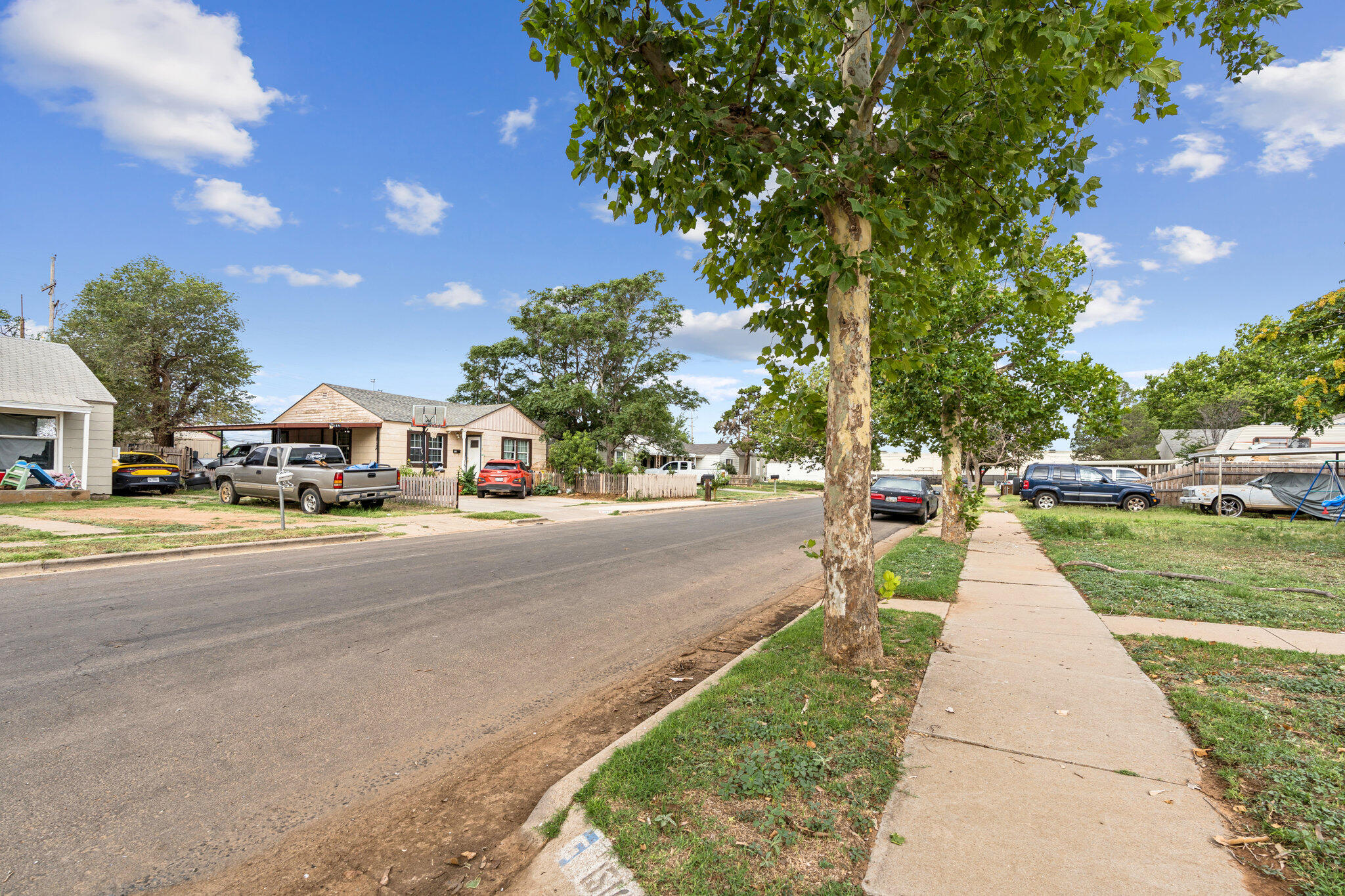1510 33rd Street Lubbock, TX 79411 - Photo 3 of 33 a city street lined with buildings and trees
