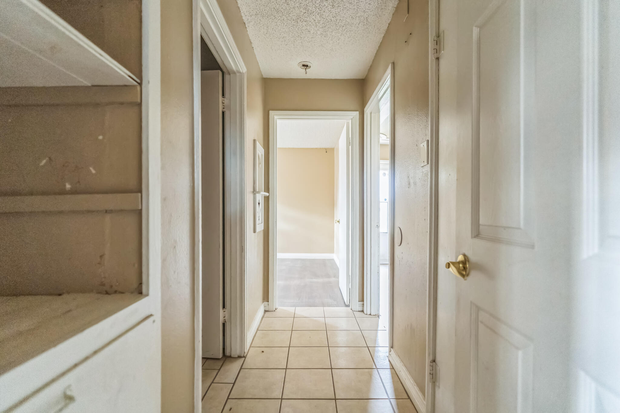1510 33rd Street Lubbock, TX 79411 - Photo 32 of 33 a view of a hallway with wooden floor and a bathroom