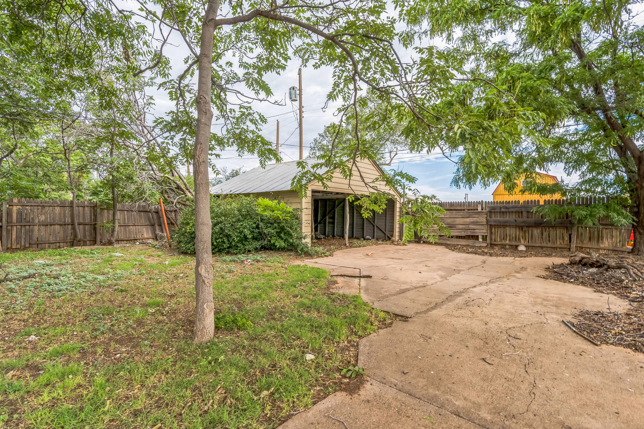 1510 33rd Street Lubbock, TX 79411 - Photo 8 of 33 a front view of a house with a yard and tree