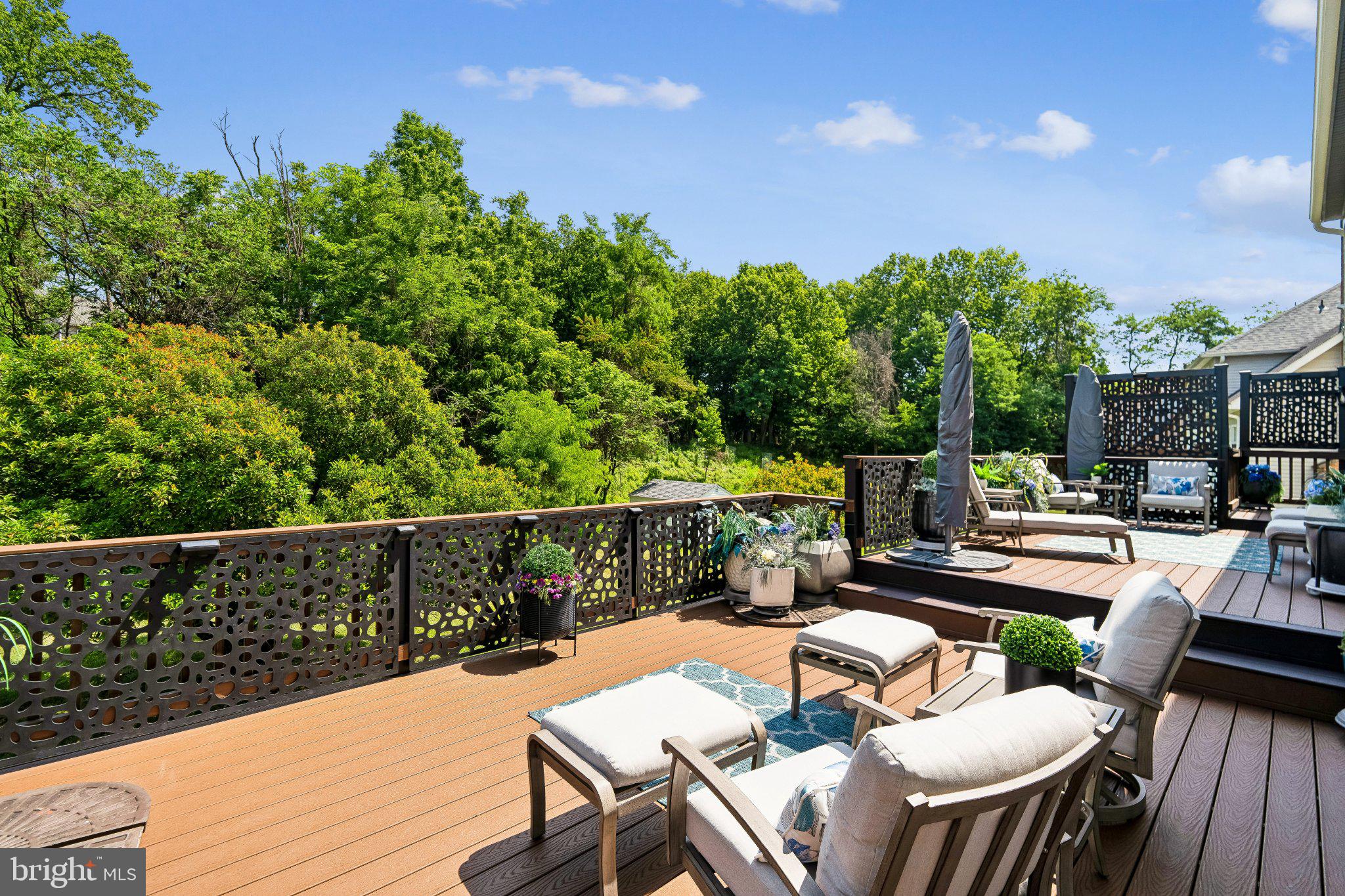 9505 Bald Hill Road Mitchellville, MD 20721 - Photo 5 of 39 Serene deck with lush green backdrop.