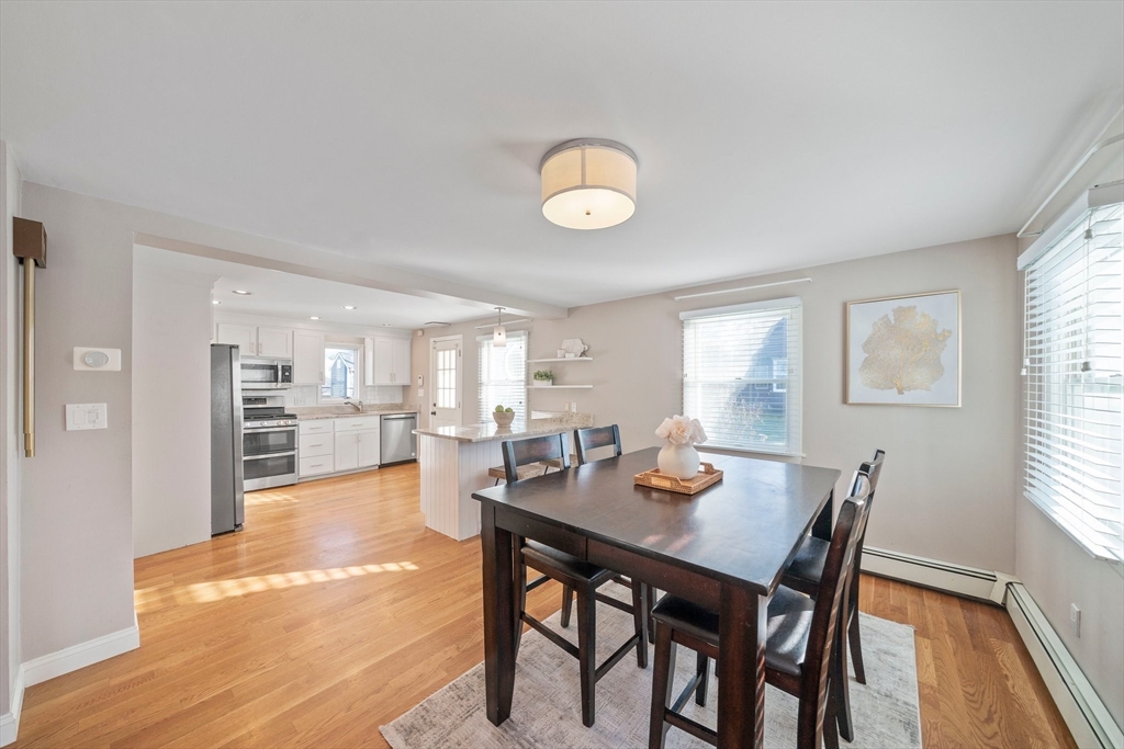 91 Prospect Street Canton, MA 02021 - Photo 12 of 41 a view of a dining room with furniture and wooden floor