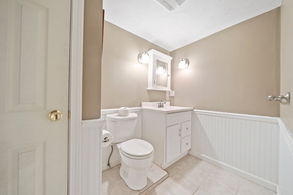 91 Prospect Street Canton, MA 02021 - Photo 29 of 41 a bathroom with a toilet sink and mirror